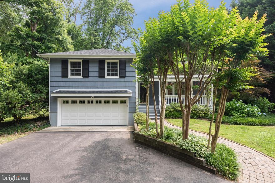 This charming home, with a delightful, trellised front porch, sits on a pretty landscaped .5 acre lot in coveted St. Margarets area. The circular driveway adds to the charm. Pretty vaulted ceiling living/dining room w/ fireplace. Gourmet chef's kitchen w/upscale SS appliances and chef gas range. Large family room on lower level w/gas FP & built-ins walks out patio for entertaining. Fenced yard with gardens out back. Broadneck Schools. Close to Historic Annapolis and routes to DC and Baltimore.