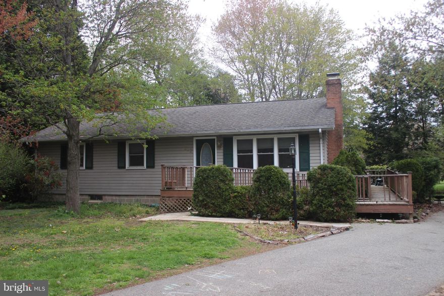 Ranch style home in Chester Harbor with 3 bedrooms and 2 full baths features hardwood floors throughout most of the main level, updated kitchen and a partially finished basement.  Large, 3 lot parcel with mature trees and large shed.  Handicap accessible with full ramp to main entrance and side deck.