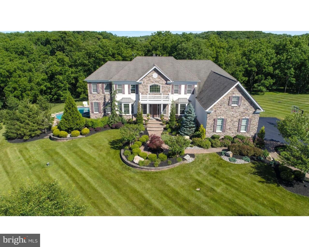 Breathtaking nine year old, 5 bedrooms, 4 full and 2 half bath home! Check out the 3-D Tour above! This home has beautiful landscaping and is perfectly positioned to take advantage of long range views in Dutchess Farms community. Extensively upgraded throughout. Beautiful foyer with double staircase. Parlor, formal living room with gas, stone, fireplace, lots of windows, formal dining room, bar area, office, powder room and main floor laundry. Amazing hardwood floors. Large custom kitchen with, island, stainless steel appliances, double oven, wall oven and beautiful cabinetry. Upper level features 4 large bedrooms in addition to Master Suite, each has there own bath. Master bedroom suite shows off, sitting area, luxurious master bath, and walk-in closet. Lower level boasts, theater room with stadium seating, wet bar, entertaining area, exercise room and powder room. Outside exit, to the extensive hardscaping, landscaping and magnificent built-in pool. 4 car garage. Must see to truly appreciate the beauty in this home. Toll Brothers completed remediation on stucco and stone.