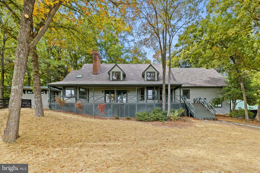 Nestled within the peaceful landscapes of Orange Hunt Country, this property offers a unique opportunity to experience rural living at its finest. Spanning 50 acres with beautiful westerly views, this property harmoniously combines modern comforts with classic charm.
The main house, covering nearly 5000 sq ft, has been meticulously renovated to offer the utmost in comfort and style. Featuring a main-level owner's suite, heart pine floors, and a gourmet kitchen, this home exudes timeless elegance and practicality. Upstairs, you'll find three well-appointed bedrooms and a stylishly updated bathroom, providing space for family or guests. Additionally, the main house includes a convenient mudroom, complete with a full bath and laundry facilities, making it a perfect space for active lifestyles. For those with a penchant for cars or hobbies, there are five well-maintained garages, offering ample space for your vehicles and personal projects.
Complementing the main residence, the 2000 sq ft guest house is a unique haven. With two bedrooms, two bathrooms, a full kitchen, and a spacious living area, it offers complete independence and comfort for your guests. The guest house also boasts a large private deck and patio, providing a serene spot to enjoy the outdoors.
Equestrians will find the 16-stall center aisle barn a gem, equipped with a tack room, wash stalls, and an office. The exterior also features extensive patios off the rear stalls. The upper level of the barn has a 2-bedroom apartment for caretakers or additional guests, a polo training cage, and extensive areas for storage. The land has been carefully partitioned into 9 paddocks, a riding ring, as well as three other outbuildings.