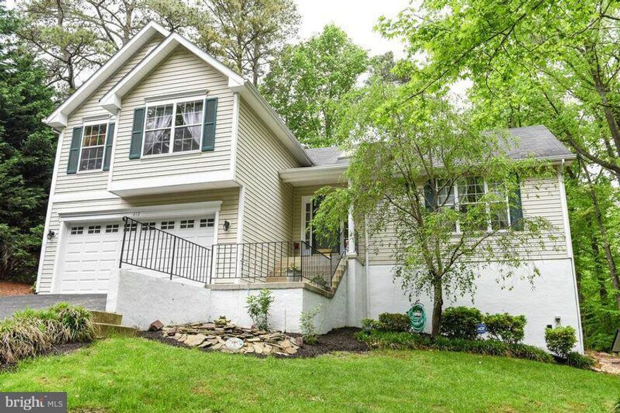 Beautiful 4 level home w/an additional lot for a total of almost 1/2 acre.  Open floor plan w/ cathedral ceilings, kitchen w/breakfast area, doors open to deck and patio.  Finished recroom, basement bedroom w/full bathroom, wood stove, tons of storage.  2 Car Garage, separate parking pad for additional vehicles.  Must see this home to appreciate all of the space it has to offer. Cartus Relocation