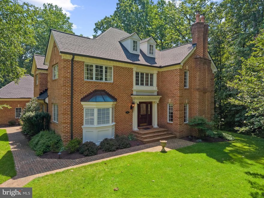 Sited on a quiet cul-de-sac in prestigious Belvoir Farms, this beautifully maintained French inspired 7,000 square feet home boasts refined living space on an exceptionally private one-acre homesite - rare for the community. The property is completely surrounded by open space with mature trees and serene woodlands, and provides a level of seclusion and tranquility that sets it apart from many others.
The home features a new roof and driveway (2025), offering both peace of mind and curb appeal. Inside, there are many new or upgraded amenities such as marble, granite, and onyx countertops, flooring, and closets. The main level showcases a formal living room, spacious family room, and elegant dining room, along with an eat-in kitchen equipped cherry cabinets and professional-grade appliances - ideal for everyday living and entertaining. A versatile main-level bedroom can also serve as a sun-filled morning room, private office, or guest apartment. Rooms on all levels are appointed with custom millwork trim.
Upstairs, the primary suite is a true retreat, complete with a cozy fireplace and custom-designed closet. The primary bath features a skylight, whirlpool bath, bidet, and marble counter and shower with side sprays. Three additional bedrooms provide generous accommodations, while the finished third level offers flexible space for a fourth bedroom, studio, or home office.
The fully finished lower level is designed for entertaining, featuring a media room, expansive recreation area with fireplace, powder room, closets, and a full custom bar with sink, dishwasher, Viking refrigerator, and Sub-Zero wine/beverage fridge. A bonus room adds even more versatility for a gym or hobby space.
Outdoor living is equally impressive, with an expansive terrace with natural travertine paving, outdoor Viking kitchen, and a heated saltwater plunge pool with smart technology - creating a private resort-like experience at home. The property also includes an attached 24’ x 26’ oversized 2-car garage with storage cabinets. A detached 24’ x 26’ oversized 2-car garage includes a storage closet, in-wall heaters, and finished space above, ideal for a studio, office, or guest suite. The property has an irrigation system, landscape lighting, and emergency backup generator.
The Belvoir Farms community offers a lifestyle unlike any other, with abundant open space, scenic walking trails, and gate accessible private marina on the Severn River via Maynadier Creek - just a short walk along the private trail from this home. Residents enjoy a boat ramp, kayak launch, fishing and crabbing pier, and boat slips available for rent or purchase, making waterfront living easily accessible. The community also features tennis and pickleball courts, a playground, and natural wildlife areas. 
Ideally located just across Generals Highway from the newly renovated Preserve at Eisenhower Golf Course providing access and amenities comparable to a community owned Golf Course without expense of a membership. This property is located within minutes to Route 50 and I-97 for easy access to BWI Airport, Washington, D.C., Baltimore and Delaware. This home combines luxury, privacy, and convenience in one exceptional offering.
Welcome Home!