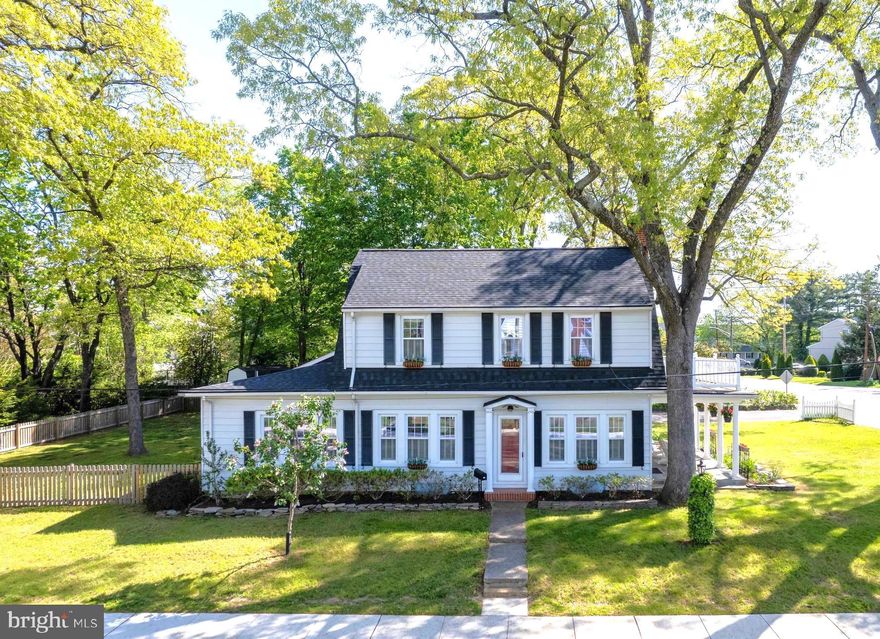 Old Charm Meets Modern Sophistication   Don't miss this charming home in Olde Glen Burnie, it is a real show stopper with so much to offer!  2,031 SF lovingly maintained and tastefully updated 4 bedroom 2 full bath colonial on a large .32 acre corner lot with a fenced backyard and an oversized 2-car garage!  A must see redesigned kitchen in 2022 offers beautiful cabinetry and quartz counters, stainless appliances, a stunning bay window, perfect for growing indoor herbs with views of the deck and backyard and, don't miss the walk-in pantry and coffee bar! with plenty of space and storage for all the necessities.  Serve meals with ease in the adjoining dining room accented by crown molding and custom plantation shutters into the living room that is anchored by stunning oak flooring, a gas fireplace and beautiful staircase, there's even room for your piano!  Stay awhile or wander outside to the picturesque covered slate patio perfect for unwinding in the evenings and enjoying lazy days in the shade under the restored Juliet's balcony.  At the other end of the house there is a huge main level family room complete with built-in bookshelves, a separate entrance into the backyard.  This wing also boasts an updated full bathroom and bedroom that is the perfect space for guests, in-law, au pair, or home office.   On the upper level you'll find 3 additional bedrooms and a full bath showcasing original tile-work recently re-grouted and in beautiful vintage condition.  Enjoy quiet moments on the balcony off the primary bedroom; all bedrooms feature tall replacement windows, hardwood flooring and ceiling fans!  Big Ticket Items DONE!  Major updates within the past 4 years include:  New Roof (House and Garage), New HVAC (electric w/gas backup), New Water Main Line, New Garage Doors, New Fencing, New and Refinished Hardwood Flooring, New Kitchen & Main Floor Bathroom!   Other improvements include updated insulation in attic for energy efficiency, French drain tile system in the basement, 5-panel shaker style wood doors, replacement windows and doors and more!   Plenty of off-street parking in the oversized detached 2-car garage and 4-car driveway.   Enjoy the outdoors right at home in your lovely, landscaped yard, on the deck or patio or, take a quick walk to the B&A Trail.  Terrific commuter location to Ft. Meade/DC/Balt/Annap with Rt 97 / 100  / MARC / Amtrak / BWI nearby.