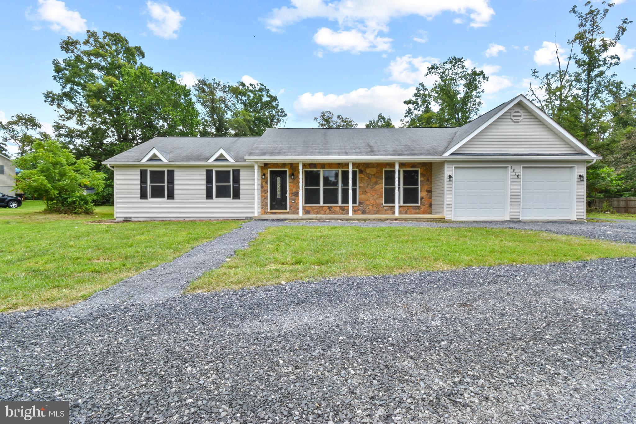 Welcome to your dream home at 1810 Rivermont Dr, nestled in the heart of scenic Front Royal, Virginia! This charming single-family residence offers the perfect blend of modern comfort and serene countryside living, just minutes from the Shenandoah River and Skyline Drive.
This freshly painted, (owner is having new roof installed July 25) move-in-ready home features 3 bedrooms and 2 bathrooms across 1,656 sq. ft. of living space. The updated kitchen boasts stainless steel appliances, quartz countertops, and island perfect for entertaining. The open-concept living area includes hardwood floors and a cozy fireplace. Situated on a 1.25-acre wooded lot with no HOA, this property offers privacy and space for outdoor activities. Enjoy a covered front porch and a spacious back deck with stunning views of the Blue Ridge Mountains, ideal for morning coffee or evening gatherings. The home also includes a mud room with garage and side entry access, 2 car garage, and a large dual entry gravel driveway for convenience and ample parking.
Located just 5 minutes from public access to the Shenandoah River for kayaking, fishing, or swimming, and a short drive to downtown Front Royal’s shops, restaurants, and historic charm, this home combines modern amenities with the peace and beauty of Virginia’s countryside. Whether you’re seeking a primary residence or a vacation retreat, 1810 Rivermont Dr is a rare find in a competitive market where homes sell quickly.
Schedule your tour on showing times today!