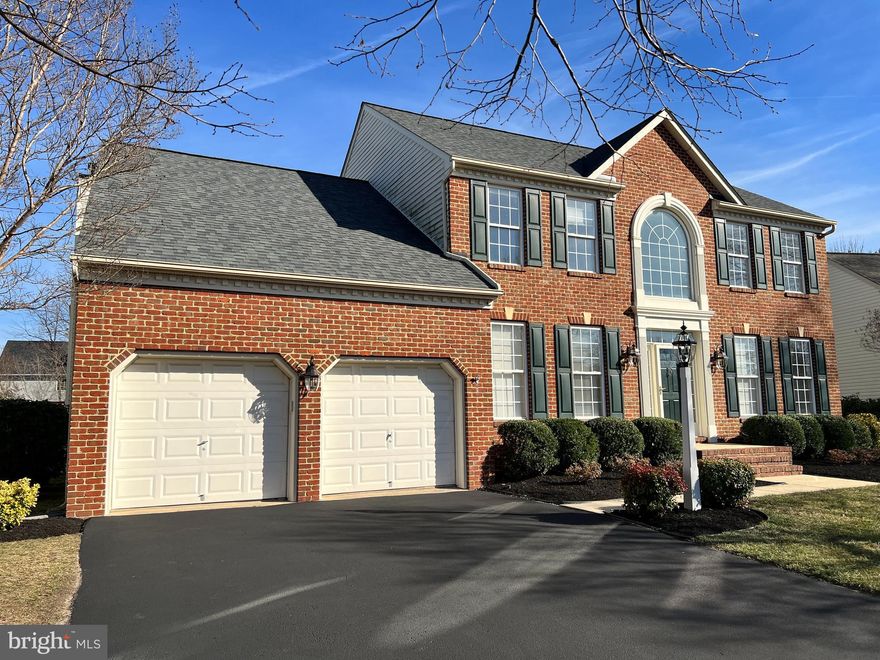 OPEN SATURDAY 2/17 11-3:30 and SUNDAY 2/18 11-3!    Welcome to your dream home at 8215 Green Ice Drive in the sought after community of Farmington Village! This meticulously maintained property offers an array of features that ensure comfort, style, and functionality. As you enter the home, you'll be impressed with the soaring 2 story foyer, gleaming hardwood floors and incredibly spacious room sizes! The formal living and dining rooms offer plenty of space and are perfect for entertaining, hosting holiday gatherings or simply relaxing at the end of the day. As you move from the dining room into the gourmet kitchen, you'll fall in love with the abundant cabinets and exceptional pantry space, not to mention the white cabinets, quartz counters and stainless appliances.  Any culinary enthusiast who enjoys cooking and meal prep will love the large island and that features a built-in electric oven, and thoroughly enjoy the gas range with a 5-burner gas cooktop and French door refrigerator.   The breakfast room is perfect for quick on-the-go meals with access to the deck making outdoor grilling is a breeze.  Embracing the open floorplan, the 20x16 family room is located adjacent to the kitchen and breakfast room and features a gas fireplace and ceiling fan.  From the foyer, the home office is delightfully laid out with French doors that will keep your workspace and conversations private. You'll love the convenience of the mud room and powder room on this level, as well.  On the upper level, as you enter the primary suite, you'll be delighted with the spaciousness of this bedroom, as well as the fabulous size of the primary bath, complete with a large corner soaking tub, separate shower, and oversized vanity.  Two additional bedrooms and a hall bath complete this level.    The lower level of this home is an entertainer's paradise, featuring a "true" 4th bedroom and full bath, a large 30x14 rec room ideal for family fun and games, a spacious den (16x13), and a craft area with convenient access to the walk-up stairs accessing the rear yard.      Enjoy outdoor living at its finest with a 16x20 screened porch, a spacious deck, and a gorgeous fenced, level rear yard, making it perfect for gatherings or simply enjoying the serene surroundings. Additionally, the property boasts one of the largest lots in the community, offering endless possibilities.  Storage is never an issue with great attic space in the garage (complete with pull-down stairs) and additional storage space accessible from the primary bedroom walk-in closet. Key updates include a new roof in 2016, a water heater installed in 2023 (50 gallons), and HVAC (furnace and A/C) replacements in 2023, ensuring peace of mind for years to come!    Nestled within the esteemed Farmington Village community, this home offers access to an array of amenities that enrich daily life. Farmington Village boasts a vibrant array of features, including a community pool, clubhouse, tennis courts, tot lots, and scenic paths that wind through the neighborhood. Conveniently located with easy access to Baltimore, Annapolis, Ft Meade and BWI, the opportunities for work, dining, shopping and entertainment are endless!