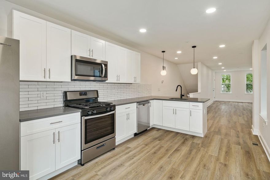 Be the first to live in this brand newly renovated 2 bed, 2 bath bi-level unit with all new appliances including in unit washer and dryer. Each bedroom has their own PRIVATE luxury bathroom. Enjoy the private rear yard off the kitchen.  A 5 minute walk to the El subway stop with only a short ride to Center City, 7 minutes from Temple University & in walking distance to all that the Frankford Ave and Front St social districts have to offer. Tenants responsible for all utilities. No smoking in the building. First & last month's rent also due at time of lease signing.