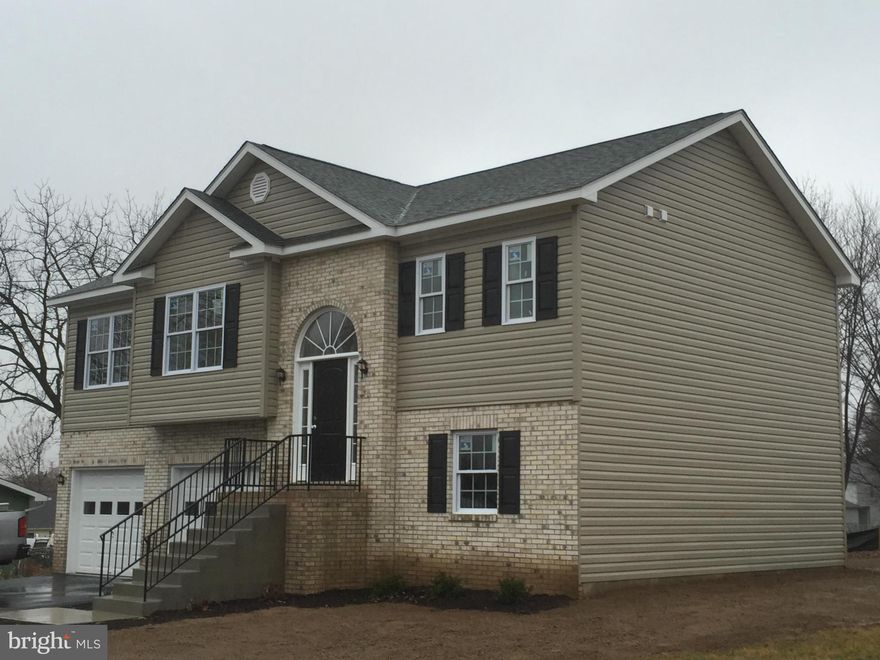 This 3 bedroom 2 bath well constructed home has master bedroom split from the other bedrooms on the opposite end of the house. Features kitchen dining room opened to family room. Laundry room is on  bedroom level. Spacious garage in the basement and a rough in bath! Near schools, shopping and majors roads.