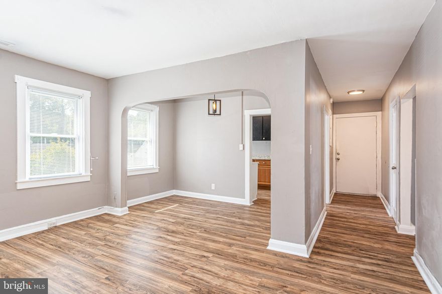 SPACIOUS UPDATED 2 BEDROOM 1 BATH APARTMENT! This unit is located in an 8 unit building and features all wood floors, spacious living room, separate dining area, galley kitchen, 2 large bedrooms, 1 full bath, and in unit laundry. Located steps from Bengie's drive through, shopping, and restaurants!  Pictures are of a different unit in the same building with similar finishes.