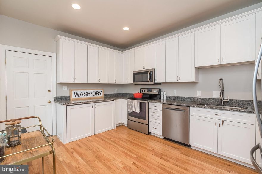 Beautiful 2 bedroom 2.5 bath EOG townhome in Federal Hill! Large living room w/ ample natural lighting & hardwood floors that flow into the dining room and into the updated & open gourmet kitchen w/ granite counters & ss appls w/ access to the private rear patio, great for your grill! UL hosts the master bedroom w/ attached full bath, 2nd bedroom, full hall bath & entry to the rooftop deck!!