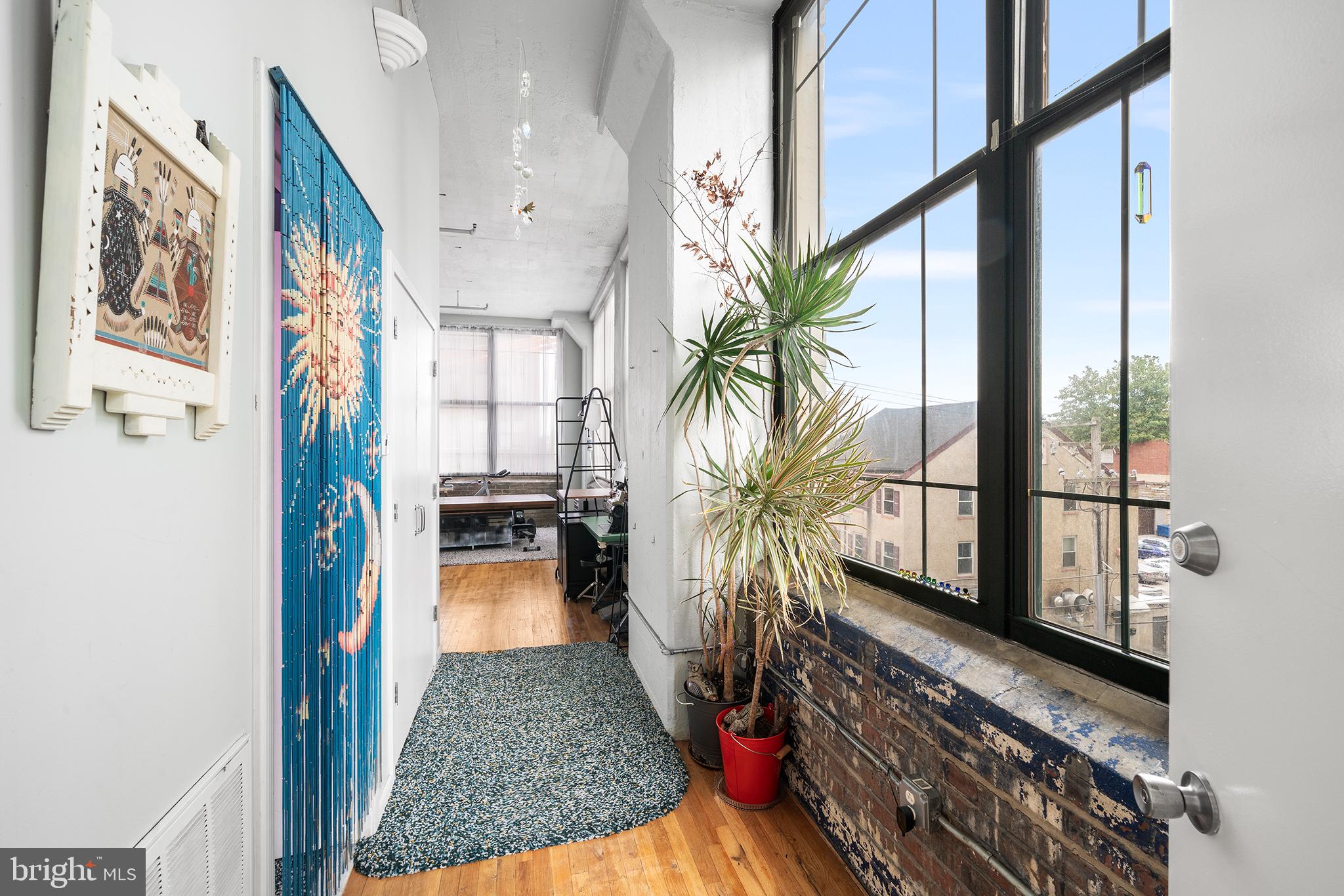 Welcome to 314 N. 12th St. #301, a delightful 730 square foot studio in the beautiful Old Shoe Factory Condominium. This corner unit is bathed in natural light thanks to its north-east exposure, featuring nearly 50 feet of windows and soaring 11.5-foot ceilings. The exposed brick beneath the windows and original hardwood floors add character and warmth to the space.
The full kitchen is equipped with everything you need to keep meals simple or entertain a crowd, making it the perfect gathering spot. The open layout invites creativity and customization—whether you choose to divide the area with furniture, build a platform for added dimension, or keep it airy and open, the possibilities are endless. The spacious bathroom includes a tub, a linen closet, and stackable laundry, complemented by ample storage space above and beside.
Convenience continues with a coat closet in the hallway for easy transitions in and out of the city, as well as a secure mailroom, freight elevator for moving day, and both a passenger elevator and chair lift for accessibility.
Street parking is available, with a parking lot just around the corner for those seeking a monthly option.
Situated in one of Philadelphia’s most exciting and developing neighborhoods, you’ll be steps away from local favorites like Elixir Coffee, Cafe Lift, and Love City Brewing. Explore the vibrant offerings of Reading Terminal Market, and the Convention Center, along with the diverse attractions of Chinatown, Midtown Village, and the Art Museum area. The proximity to the expanding Rail Park provides a wonderful place to walk the dog, meet neighbors and watch the sunrise. With I-676 and the Broad Street Line just a block away, commuting is effortless.
Don’t miss this incredible opportunity to own a piece of Callowhill’s charm—schedule your showing today!