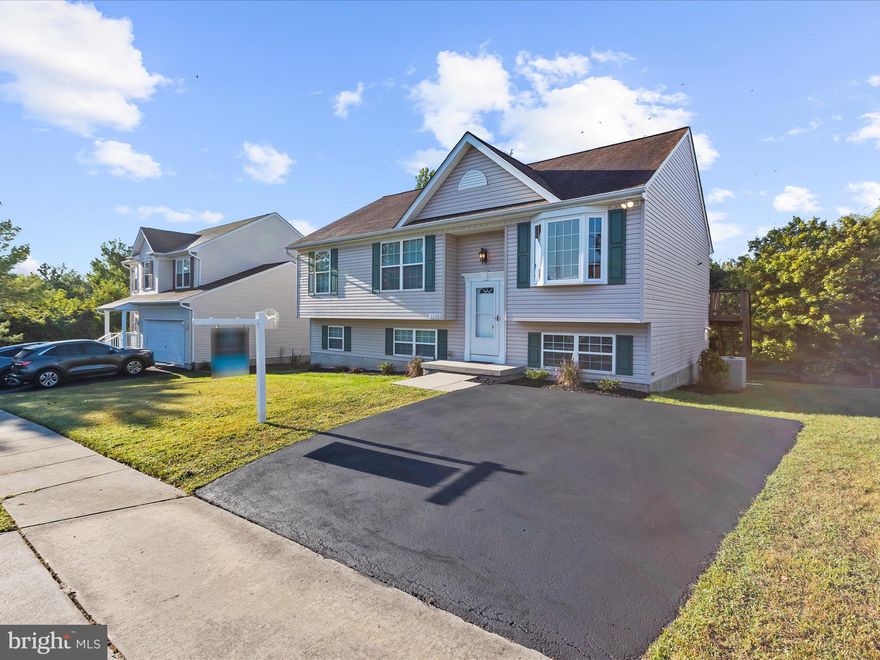 Welcome to 2208 Geipe Road, Catonsville, MD!
This beautifully renovated split-level single-family home offers the perfect combination of modern design and a serene setting, backing to a private wooded area in one of Catonsville’s most desired neighborhoods.

With a total of 2,367 interior square feet, this home provides generous living space across multiple levels. The upper level features 1,214 sq. ft. of gross living area, complete with gleaming hardwood floors, a spacious open-concept living and dining area, and a brand-new designer kitchen with modern cabinetry, stylish countertops, and black stainless steel appliances. Upstairs you’ll also find 3 bedrooms and 2 fully remodeled bathrooms, including a private en-suite. From the main living area, step out through sliding glass doors to a large deck—perfect for entertaining or enjoying peaceful wooded views.

The lower level adds 1,004 sq. ft. of finished living area, including a comfortable family room with backyard walkout, a 4th bedroom, and a full bathroom—ideal for guests, a home office, or multi-generational living. A convenient laundry room with extra storage provides additional functionality and organization.

Nestled at the end of a quiet residential street, this home provides a relaxing retreat while still being close to Catonsville’s shops, restaurants, schools, parks, and commuter routes.