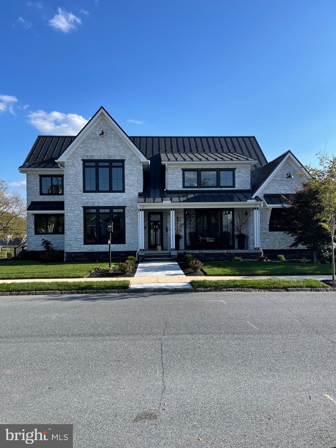 Spectacular Custom Built Home with Upgrades Throughout! As you enter the home, you will be greeted by vaulted ceilings in the stunning great room which has a bonfire gas fireplace surrounded by stone - the perfect space to entertain or watch the big game. Sliding doors located in the front and the back of the room allow for unique indoor-outdoor living options. The open floor plan flows into the kitchen where custom cabinetry, a massive island with quartz countertop and seating for 6 awaits. The chef in the family will enjoy the gas cooktop, double ovens, incredible prep space and walk-in pantry. The wet-bar, beverage refrigerator and built-in Bosch Coffee Maker are ideal for family gatherings. The breakfast bar has a window that can be opened. It seats 2 additional people Outside! This is better than HGTV! A barn door separates the great room from the first level primary bedroom with a huge walk-in closet any shopper will appreciate and an ensuite with tile shower and dual sinks. Working remotely? The first level office offers loads of natural light and privacy. First level laundry and a half bath round out the first level. The second level has an Additional Primary Bedroom! Retire to this beautiful space which has a gas fireplace and sitting area with views of the Kissing Tower, a large walk-in closet, an ensuite with dual sinks! Two additional bedrooms, a study area and a full bath round out the second level. Enjoy outdoor living? The back porch with stone flooring, a porch swing, a gas fireplace flanked by stone and space for a large television is the place for you! Wait until you see the Over-Sized, Heated Garage which has access from the street or the back yard! The stately exterior of the home has stone on all four sides and the metal roof is top of the line with a Standing Seam The corner lot is .3 acres and provides a nice back yard space for a football or hosting a barbecue. Location, location, location! Walk to school, in-town shops and restaurants or the new Recreation Center. Approximately 2 miles to Hershey Medical Center and close to highways and the airport, it's a Must See!