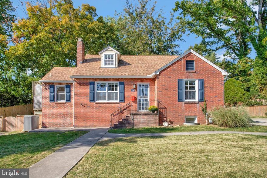 Rare opportunity to own an all brick cape cod with a primary en suite on the first level!  This spacious cape has been bumped out to offer a very large kitchen area perfect for family get togethers, with a skylight infusing the area with lots of natural light!    Adding to the warmth of the home is  a stone fireplace and wood flooring throughout.   Washer and dryer are also located on the first floor for great convenience.  This home could be all one-level living if desired but also offers two addition bedrooms on the second floor as well as a basement that is a blank canvas awaiting your personalization!  Located on over a third of an acre in the heart of Linthicum Heights, you have the benefit of small town living while convenience to all major thorofares!  Generous driveway, constructed of 8" reinforced concrete,  allows plenty of parking for a multi-car family!  Please note:  Walnut tree at back of driveway is dropping it's walnuts right now so recommend not pulling all the way in at this time.  Thank you!