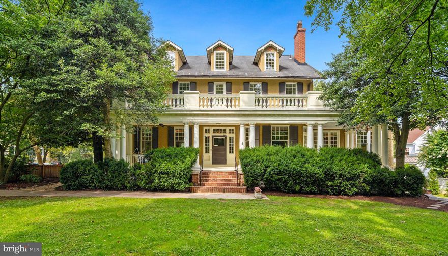 Built in 1908, this exquisite Colonial Revival is one of the original grand dames of Chevy Chase Village. It is graciously proportioned and has been beautifully updated by the current owners including a two-story addition designed by architect Cliff Elmore and built by Mauck-Zantzinger. With seven bedrooms and four-and-a-half bathrooms, the interiors feature four stories of livable space aggregating approximately 8,850 square feet according to Interior Footprints, LLC on a 16,667 square foot lot according to Public Record. The spectacular entertaining rooms all have grand scale and soaring ceilings. There are six working fireplaces, hardwood floors, double-hung windows, glass door transoms and many more historic architectural details throughout.

As you enter the palatial residence from the original colonnaded wrap-around porch, you are greeted by an elegant foyer / gallery that is flanked by a corner living room and formal dining room with a bay window – both are enormous and have wood-burning fireplaces. A corner home office, powder room and walk-in coat closet are also off the foyer / gallery. The gourmet eat-in kitchen was custom designed and features marble countertops, a large center island, a peninsula bar with seating, an abundance of storage, two sinks, a pantry, a built-in desk area, and top-of-the-line appliances including a Subzero refrigerator and freezer, a Miele dishwasher, two Wolfe wall ovens, and a Wolfe six-burner gas range. The kitchen opens into the magnificent family room that has 11’9’’ ceilings, a wood-burning fireplace and a dramatic glass-paned inglenook lined with window seats. A breakfast area, separate walk-in dry bar, back staircase down to the lower level and access to the porch through French doors complete this room. Up the stately staircase from the foyer / gallery to the second level you will find the primary bedroom that was originally two rooms and is now a luxurious corner suite that has a wood-burning fireplace, two walk-in closets, a dressing room, and two separate points of access to the terrace overlooking the luscious grounds. The renovated primary bathroom features a double vanity, walk-in shower, soaking tub, and ample storage. Also on this level are two additional corner bedrooms – one with a wood-burning fireplace and both with walk-in closets. The bedrooms share a renovated Jack-and-Jill bathroom that features a double vanity and bathtub/shower combination. The third level of the home has three more bedrooms all with generous storage, and a renovated hallway bathroom with a walk-in shower. There is also a shared sitting area and attic / utility room on this top floor. Down a separate staircase from the main level to the finished lower level is a large recreation room as well as an entertainment / media room that has a gas fireplace and walks out to the flagstone patio and landscaped yard. Another bedroom, hallway bathroom with a bathtub, laundry room, wine storage and two utility rooms are on this lower level. The impressive grounds of this property are completely fenced in and offer incredible privacy from its surroundings with mature trees and bushes. We are pleased to present this wonderful home to the market, the current owners are among just a few residents to have owned this grand dame including a prominent judge who had originally built it as a vacation estate!