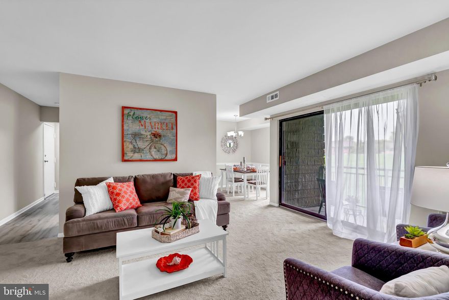 Enter this light filled unit and be pleasantly surprised at the space and quality you can get at this price!  Completely refreshed with new carpet/flooring, fresh paint, new kitchen and bath and HVAC was replaced in 2023.  This lovely unit is well located with serene views of green space and/or the community garden from every window and the spacious balcony.  The modern, white on white kitchen is elegantly appointed with soft-close cabinets, stainless steel appliances and silestone countertops.  The bathroom is modernized with marble-look tile, new vanity and lighting.  Closet space galore in this unit with 2 walk-in closets, one in the primary bedroom and one for general storage in the hallway (in addition to a linen/coat closet), two other bedrooms feature nicely sized closets as well.  Gates are in the process of being installed in the parking lots.