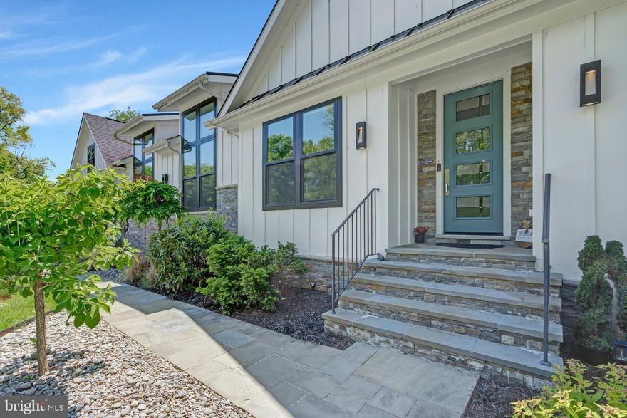 Discover this extraordinary home nestled in the desirable Stratford Landing neighborhood. Rarely available, this custom-designed, turnkey residence was built by Brush Arbor Homes in 2017. The striking exterior features Hardie board-and-batten siding with stacked stone, an architectural shingle roof with standing-seam metal accents, a two-car garage, and black Andersen windows.

A flagstone walkway and raised porch lead to the beautiful 8-foot Thermatru entry door. Step inside to experience the unexpected. Oversized Andersen windows fill the home with natural light and provide serene, elevated green views. Soaring 11-foot ceilings, warm wood and tile flooring, built-ins, ceiling fans, and designer finishes create a cohesive feel throughout. The timeless open layout supports comfortable everyday living while offering effortless flow for elegant and large-scale entertaining.

The thoughtfully designed eat-in kitchen serves as a central gathering space, featuring two multifunctional islands, a large beverage station, an oversized pantry, granite and quartz countertops, stainless steel appliances, and direct access to the expansive deck. The kitchen opens seamlessly to the large family room, where a contemporary stone-surround wood-burning fireplace creates a warm focal point. The partially covered deck with skylights extends the entertaining space outdoors, while the adjacent dining room features 10-foot sliding glass doors—perfect for more intimate dinners.

The family entrance provides convenient access to the laundry room, complete with built-ins and a dog shower for those messier moments.

Privacy awaits in the ideally located primary suite, which includes a spa-like bath with abundant natural light, a soaking tub, oversized dual-head shower, dual vanities, and a custom built-in closet. The west wing of the home offers a dedicated custom-designed study hall with built-in shelving, three generously sized secondary bedrooms with ensuite bathrooms, a fourth secondary bedroom or flexible room, and a powder room.

The lower level offers an expansive, light-filled recreation room with a full wet bar, wine closet, powder room, and media area with Dolby surround sound in-wall speakers and subwoofer. Additional features include a large home fitness center with a two-person hemlock sauna, an oversized game or flex room, abundant storage, and plenty of space to play.

A standout feature of the home is the impressive indoor sport court located on the main level. With 17-foot ceilings, individual climate control, performance flooring, high-density wallboard, and extra insulation, it is designed for year-round enjoyment. An elevated viewing window allows others to watch the action from above.

Outside, the neighborhood offers tree-lined streets with sidewalks and underground utilities, along with parks, tennis courts, community pools, schools, and preschools. Nearby, the George Washington Parkway provides miles of biking and walking trails and scenic views of the Potomac River.

*Floor Plan available upon request*