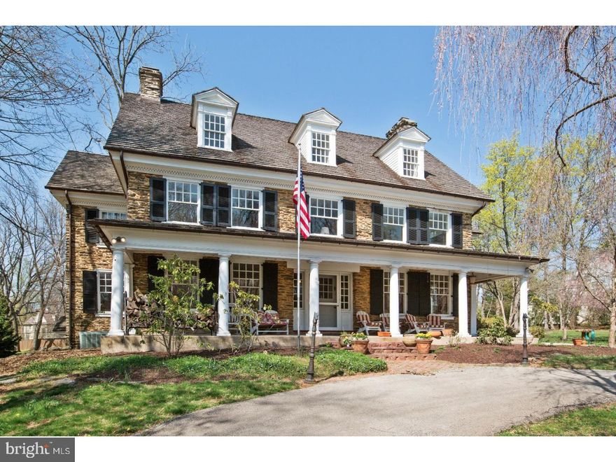 Welcome to "Burnswark". This gracious classic Colonial Revival Stone Home was designed by the renowned Philadelphia architect R. Brognard Okie and was the residence for the architect's parents. It is considered a significant piece of architecture as it is the early work of this Philadelphia master craftsman. Set back on 2.16 acres with a circular driveway and the quintessential covered full width Front Porch, this home offers a premier location with park like estate grounds.  Unparalleled craftsmanship can be appreciated as you enter the extra wide front dutch door and the front to back Center Hall Foyer. Original crown molding, wainscoting, fireplaces in the Family Room, Dining Room & Kitchen, rich hardwood floors, solid doors and deep window sills is only a short list of special features. Once inside the Foyer take note of the elegant extra wide 56 inch Staircase with a large Landing and Palladian Window overlooking the rear property. The First Floor includes formal Dining Room with original built in sideboard over cabinet, Living Room, fireside Family Room, Updated Kitchen including granite counters, SubZero refrigerator & Jenn Air double ovens, a Butler's Pantry w/Farm Sink, Office and a Mud Room. The Mud Room is an extension of the Kitchen w/matching cabinetry & a beverage refrigerator and is conveniently accessible to/from the 2nd circular driveway in the back of the property. A grand staircase leads to the Second Floor providing a Master Suite with Sitting/Dressing Room & large tiled Bath, 3 generous sized Bedrooms, full hall Bath, outfitted Walk-In Closet (formerly a Bedroom) and Laundry Room. The 3rd Floor Staircase is open and this floor offers 4 more Bedrooms (or flex space) and a renovated full Bath. Outside enjoy the 1000 square foot Mahogany Deck and flat open yard- lovely for entertaining and relaxing. The charming 2-Car Detached Garage includes newer cedar siding, roof and doors. Red Cedar roof installed on main house in 2012 w/copper leaf guard gutters, hot water heater (2013), 320 Amp updated electric, gas heat and a 2.16 Acre Lot (Potentially sub-dividable).  This stunning property is within WALKING DISTANCE to the train and Berwyn's restaurants and shops. Ideally situated in the Award Winning and nationally ranked T/E School District. Please make note of the LOW Taxes!