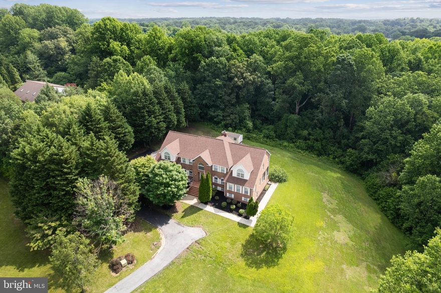 Welcome to 2820 Dunleigh Drive! This stunning 7-bedroom, 4.5-bathroom residence offers over 8,100 finished square feet of living space, perfectly situated on a private 2.5-acre lot in the highly sought-after Dunleigh neighborhood.

As you enter the home, you’re greeted by a grand foyer with a custom curved staircase that sets the tone for the rest of this expansive property. The main floor boasts an open layout featuring gleaming hardwood and marble floors, a spacious kitchen, formal dining room with butler’s pantry, great room, living room, private office, and a family room that opens to a finished three-seasons room—perfect for enjoying views of the property year-round. The two-car garage connects through a mudroom with laundry and ample storage space, offering convenience and functionality.

Upstairs, you’ll find five generously sized bedrooms, including TWO luxurious primary suites, each with dual walk-in closets and private spa-like bathrooms with marble floors. The three additional bedrooms offer plenty of storage and versatility. Brand new carpet and fresh paint throughout. The fully finished basement is ideal for multigenerational living or rental income potential. It features a second full kitchen, two additional bedrooms, a full bathroom, and multiple living and dining areas, along with a private exterior entrance.

Whether you're looking for space to grow, entertain, or host guests comfortably, 2820 Dunleigh Drive offers it all—with privacy, elegance, and endless possibilities.