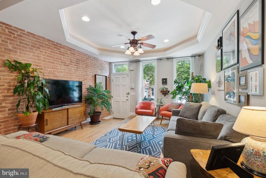 Wait until you view this in person. Fantastic first floor layout. It's huge. This house was made to entertain in! The living room can handle a ton of your friends for game night, parties or just to hang out. The kitchen is the perfect space for you to channel your inner chef.  Yards and yards of cabinet & counter space!  Prefer to throw the best cookout in the city? We have space for that, too! Spacious patio with tablespace. Lets check out the 2nd floor. Primary Bedroom with coved ceiling and tons of light. Attached bath with dual sinks, fun ceramic tile and great shower. Oh, and two closets in the bedroom! The upper hall contains the washer/dryer and a closet for towels and linens. The second bedroom also has an adjoining private bath AND a balcony!  I love the skylight on the second floor hallway. It lets in soooo much light! Let's head back downstairs...is it me or is the open stairway kinda cool?  The basement is really usable.  The 3rd bedroom is on this level. The owner has turned the basement bonus room into a home gym! There is even a full bath next to the gym! So, you might want to leave your awesome new home at some point....Head on down to the Park, just a short stroll with the pup away or choose from all the eateries that you will encounter on your walk. Make this house your new home!