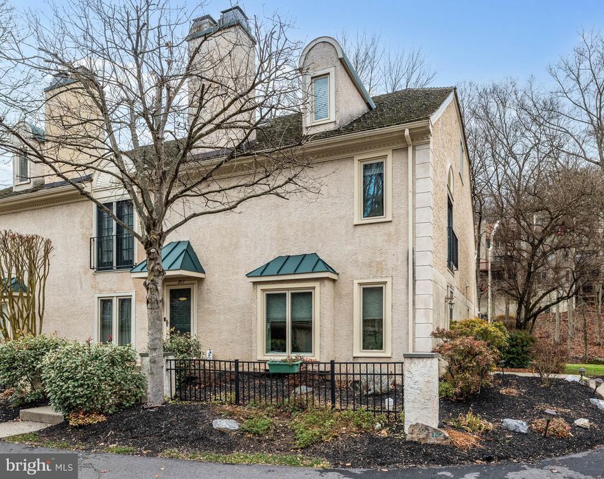 Welcome home to a carefree life in this charming   end-unit townhome beautifully framed by mature trees and landscaping in the front and the side of the home and offering a delightful blend of comfort and convenience. Step through the front door into the elegant open concept living and dining room with a wood burning fireplace as its focal point. It is the perfect space for formal entertaining or to sneak away with a book by the fireplace. Next door is a handsome kitchen complete with a breakfast bar with seating, handsome wood cabinetry, granite countertops with an attractive coordinating tile backsplash, and stainless-steel appliances, making meal prep a breeze. The kitchen is open to a bright, airy, and spacious family room with neutral flooring, skylights, recessed lighting, a ceiling fan, and plenty of room to entertain. Speaking off entertaining, don’t miss the gorgeous sliding glass doors that not only lead you to an outdoor oasis complete with a deck and views of the bucolic back yard and stream behind the home, but they perfectly frame the room with a scene by the artist named Nature. Imagine gathering with your loved ones on your private deck with these serene views. A powder room located next to the kitchen conveniently completes this level of the home. Upstairs is home to the fabulous primary bedroom suite featuring a Juliet balcony and an updated bathroom that looks like it jumped off the pages of a home and style magazine! It features a large, walk-in shower, elegant tile and flooring, and a vanity with lots of storage. Speaking of storage, check out the closet space in this bedroom. This level of the home also offers an additional spacious bedroom, a large full bathroom, and a laundry area. The third floor is where you while find the versatile loft space and a powder room. It is currently being used as the 3rd bedroom, but it can easily be transformed into a home office, art studio, or a den. Just imagine the possibilities! This home includes a one car parking garage as well as a designated parking space just steps from the front door. This fantastic home is located in the Dutts Mill community in EastGoshen Township and the West Chester School District. It is conveniently located in in close proximity to major roadways and also near to the thriving West Chester Borough, full of fabulous restaurants, boutiques, coffee shops, and so much more. Come discover this home’s warmth and potential today!