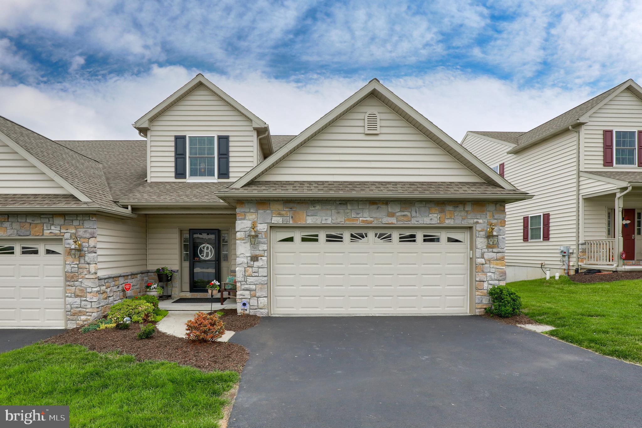 OPEN HOUSE SUNDAY 7/4 from 1:00PM to 2:30 PM!!! Low Maintenance with a 1st Floor Master Suite! Move right in to this beautifully maintained 4 bedroom home that has a fantastic floor plan and loads of natural light! The 1st floor features a master suite with a walk-in tiled shower, living room with gas fireplace, and an upgraded spacious kitchen with a huge island that leads to a bright sunroom — all with 9’ ceilings! There are sliding glass doors to a private, composite deck that overlooks wetlands and woods. Upstairs features three more bedrooms, a full bath and a loft. Plenty of room for overnight guests or a growing family! The unfinished, walkout basement with 9' ceilings offers additional possibilities! This home is ideal for any family! All new in the past year: all new paint, LVP flooring in master bedroom, gas range/stove, gas fireplace, water softener, front storm/screen door and sliding door screens! This outstanding unit offers a convenient lifestyle with no lawn to mow, landscaping to manage, nor snow to shovel! Welcome to the beautiful WoodsEdge neighborhood, featuring a very low ($100/mo) HOA fee and a fantastic setting with lovely walking trails and common areas.