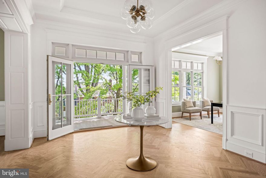 New home by Alexandria's finest luxury Home Builder,  York Construction Group.  Using only high-end  materials, crafted on-site by a Master Carpenter, this is a home with finishes you won't see anywhere else! Hand-hewn custom panelling on deep windowsills,  barrel-vaulted ceiling, multiple coffered ceilings, wainscot throughout the main areas.  


Stunning residence located in Rosemont in the City of Alexandria within easy walking distance to the Metro.  Extraordinary home in extraordinary location!!
Sited high above the street for privacy, this home has a deep front porch stretching across the entire front and wrapping around the sides. Extensive hardscape includes stone terrace walls and slate walkways in the front, side and back. 
Completely gutted and renovated, down to and including the studs, adding 2 additional floors above and expanding the basement and first floor.   This home encompasses  6000 above grade square feet  with 5-6  bedrooms and 7 1/2 baths.  And yet there is a warm intimate feel in the  main living areas of the home. 
This is a perfect blend of modern luxury living with classic details from the days when homes were built with fine craftsmanship. Custom-built  on-site  with exceptional millwork and bespoke finishes you won’t find in any other new construction in the area, such as  wainscot, panelling, coffered ceilings, crown moulding and many built-ins.  Yet the open floor plan meets all of today’s  requirements.
Upon entering the house you are welcomed by a large foyer with herringbone hardwood floors and wainscot.  The hardwood, hand-finished on site, stretches across the entire first and second floors lending warmth to the home. 
If you love to entertain, or just cook for your family, you will fall in love with this kitchen.  Thermador 48” dual fuel range (also with Induction!) separate wall oven and microwave, 2 dishwashers, farmhouse sink big enough for your largest pans, beverage fridge, 36” refrigerator and 36” freezer.  Butlers pantry is perfect - with wine fridge and wet bar, and a  separate walk-in pantry.  
The Dining Room is big enough for grand-scale dinner parties. Have a 10 or 12-foot table?  It’ll fit in this room! 
For quiet times, there is a Library/Sitting Room located just off the gracious front Foyer.
The Great Room has  coffered ceilings, deep windowsills and window seats with custom millwork, and a wood-burning fireplace that can be converted to gas if preferred. 
This space also  opens to fabulous outdoor covered porch (which could be screened-in) for entertaining a large crowd or an intimate few. 
A separate entry foyer is in the rear of the house,  convenient to the garage and parking area, and has a large mudroom for all your outerwear and accoutrements. 
Upstairs on the second floor is an open area with built-in shelving, a window sear  and plenty of room for a seating area.  
The Primary bedroom, off its own hallway for privacy, has a gas fireplace, a private porch and 2 large walk-in closets.  The Primary bath includes Studio McGee designer plumbing fixtures,  an inlaid marble floor, marble shower,  soaking tub, dual vanities and a separate dressing/make-up vanity. A laundry room and three other large ensuite bedrooms are also on the second floor, while another ensuite bedroom and additional storage are on the third floor.  
The basement has a recreation room, an ensuite  bedroom as well as the second laundry room, plus exercise/media/flex space, more storage, mechanical room,  and a brick-walled room that would be perfect for a wine cellar. 
There is a one car garage that builder could  convert to a two car and/or an ADU.  Off the rear, a porch, brick patio, stone and brick terrace walls, and a grassy area for play complete the picture.
Come see this beautiful home!!