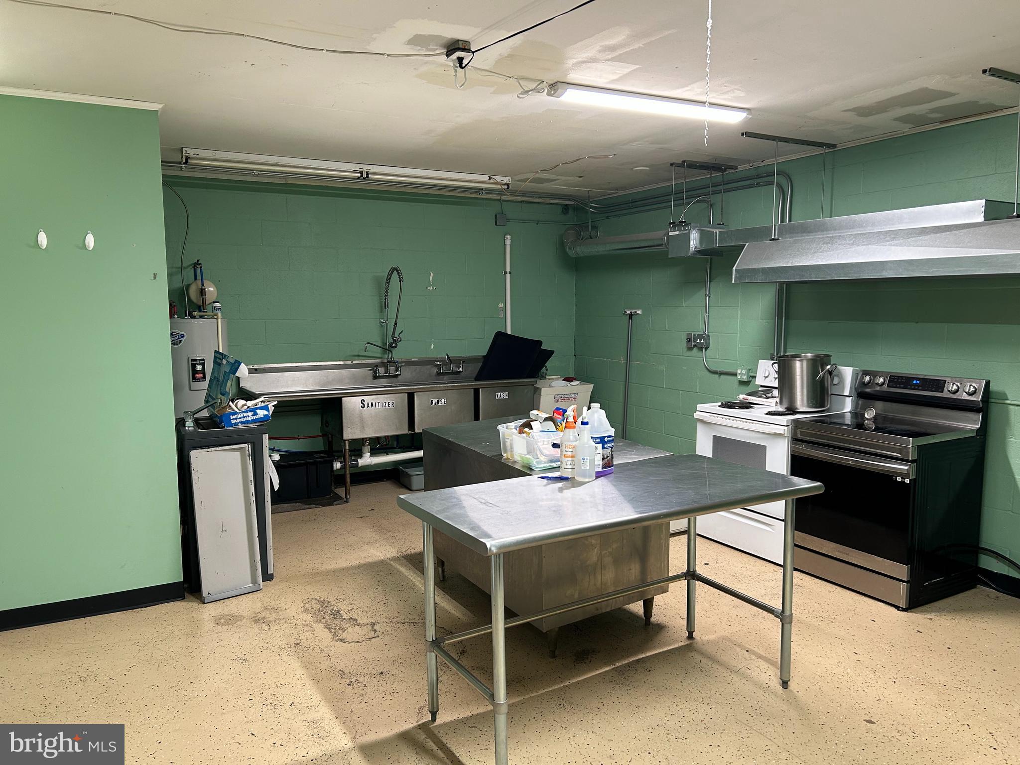 Located in downtown Hanover, this “ghost” kitchen is in a convenient location for delivering all over Hanover. This kitchen is equipped with a large ‘light duty ‘ vent hood, and deep 3 bay stainless-steel sinks, a grease trap, and other kitchen equipment.
This semi-commercial kitchen was built to work as a turnkey solution for catering owners to expand their business quickly and affordably. The space features a large open kitchen area, a private bathroom and an additional large room for storage, bookkeeping or just relaxing.
The space is 1700 SF and is nicely equipped with mini-split for heating/cooling in the break room area, lights on timers and low maintenance flooring. There is one parking space included in rent.
Due to its business presence and residential communities, Hanover is an up-and-coming food delivery market for this area. The space is located in the rear of a commercial building, making it ideal for food preparation to deliver.