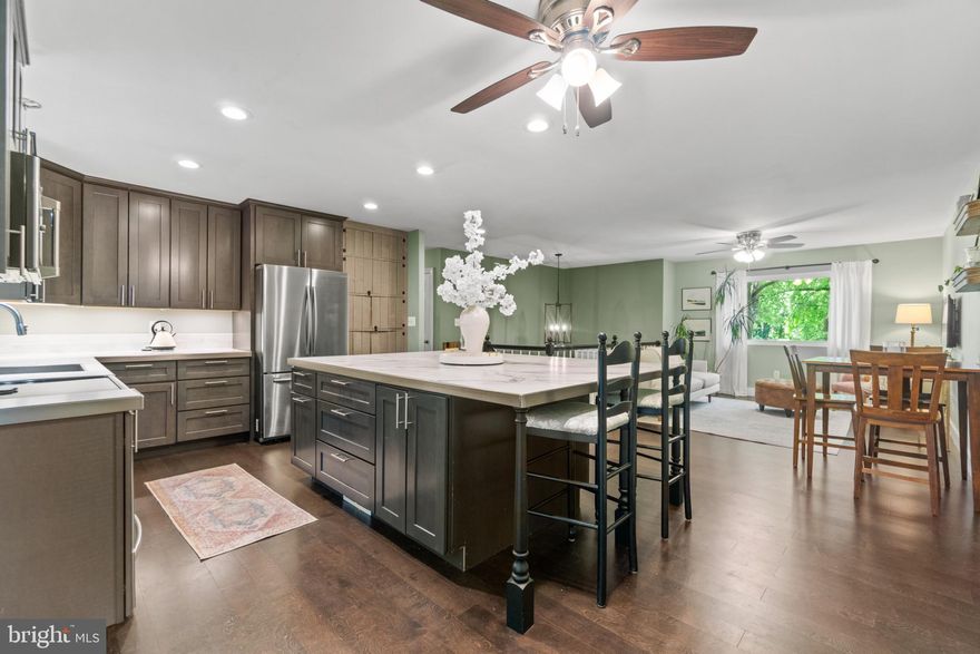 Open house canceled for Sunday.
Step into a world of luxury and convenience in this charming 4-bedroom, 2-bathroom home, nestled on over a half-acre spacious lot with a private driveway and plenty of parking. Located just minutes from the vibrant heart of downtown Annapolis.   The chef's kitchen is a gourmet's dream, boasting custom 42" cabinets, sleek stainless steel appliances, and an expansive 8ft x 5ft island, perfect for culinary creations and entertaining guests. Upstairs, your private sanctuary awaits in the primary bedroom, featuring a custom bow window, a generous closet, and a newly tiled bathroom designed for relaxation.  The bright walkout lower level is perfect for unwinding or watching a game, with the fourth bedroom on this level ideal for a home office or welcoming guests. Step onto your deck and view the meticulously landscaped, fully fenced, private backyard, the perfect setting for outdoor activities and gatherings.  Enjoy modern comfort with a new hot water heater and recent public sewer connection. Stay connected and secure with Nest exterior cameras and an indoor Nest thermostat. At the same time, the newer Thompson Creek windows and solid wood interior doors with refined moldings add a touch of elegance throughout the home.   Discover the rich history and vibrant culture of downtown Annapolis just minutes away. Explore the Naval Academy, marvel at the Blue Angels, boat on the Severn River and the Chesapeake Bay, and enjoy a variety of dining and shopping options.  For water accessibility, Ellen O. Moyer Nature Park and Quiet Waters Park nearby have a public pier to launch kayaks & paddleboards along with picnic tables and a walking trail. With a short drive to Washington, DC, the Eastern Shore, BWI Airport, Ft Meade, and NSA, this home offers unparalleled convenience. This enchanting home seamlessly combines modern amenities with an unbeatable location.