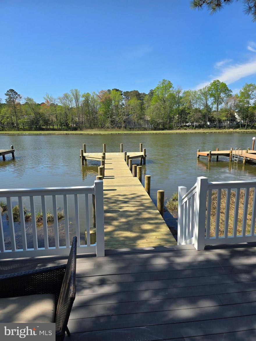 Canal waterfront completely remodeled in 2018 ,4 bedroom with 3 full baths home brand NEW pier:  5 ft X 50 ft brand new pier with " T " at the end just completed in April 2026. This waterfront home is ready for your immediate occupancy. Large sliding glass door offers you unobstructed view of Mankin Creek. Features an entry living room with a fireplace flowing into a huge fully appointed kitchen with an open floor plan leading into a family room and a large deck.  4 bedrooms including a primary water facing bedroom and bath as well as a second bedroom on the 1st floor and 2 additional bedrooms on the 2nd floor.  Heat pump {newly installed in 2018} with separate thermostats for each floor, crawl space wrapped with drainage and 2 sump pumps and dehumidifier. Also, a pellet stove, wall mounted electric heater, and 2 vinyl sheds on the side of the house. Professional Pictures to be added within 24 hours