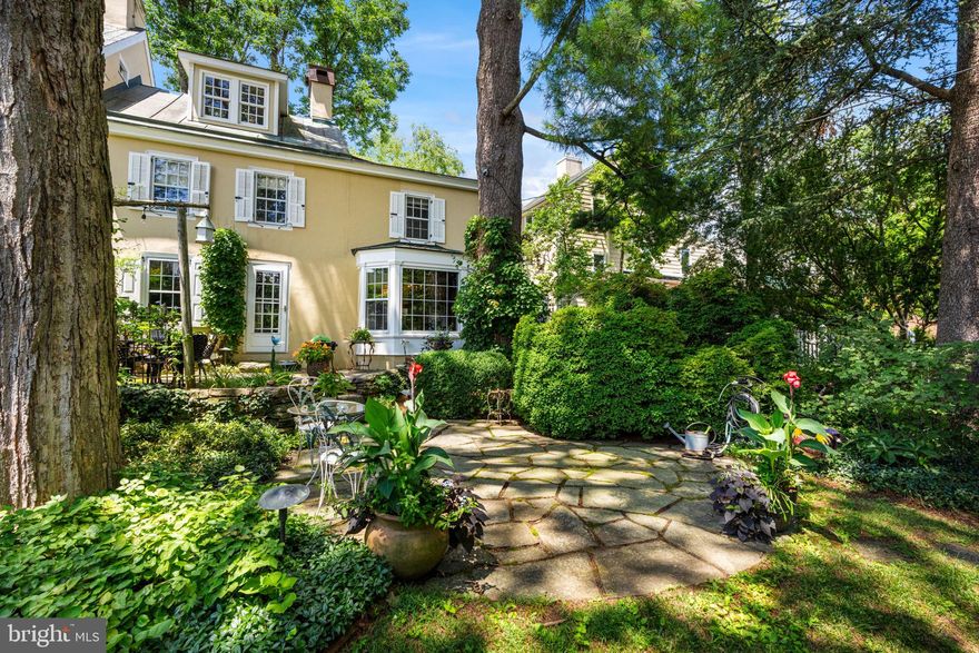 This treasured and historic home is found in the midst of all that Doylestown borough has to offer while providing the peace and tranquility of a private setting and an enchanting garden area that is rarely found. Just steps outside of the garden and the front door of this home and you will be at the County Theater, museum area and shops and well regarded restaurants. You will have a front seat view of the festivals and events that are so enjoyable while still enjoying the peace of a home that feels secluded and private. This home located in Barnes Court condominiums is one of the two residences in the original home that was built in 1804. The manicured community, located near Broad and State Streets, and accessed from Garden Alley,  features ten very special homes including those  built in 1985 when the community was established.  The transformation of this small enclave of homes into a delightful garden spot with a central koi pond and flowering gardens throughout is truly a sight for the eyes and offers a lifestyle of convenience as well beauty. The charm of this home is evident from the front entry into a former porch area, now used as a living room, to the large family room with walk in stone fireplace with an oversized slate hearth, complete with the original oven from when this room was the kitchen for the entire home in 1804. An entrance into the rear garden from an atrium door brings the outside patio and gardens to the interior of this lovely home. The walk in fireplace was converted to gas and is sure to be the central part of this home when relaxing or entertaining. Access to the kitchen with breakfast room area offers a great, flowing floorplan with  glimpses of the exterior gardens and sweet spots to sit and enjoy the scenery and your guests. A built in window seat, an extended bay window at the breakfast nook, a door to the side path leading to the garden and a large island for food preparation and entertaining make this home a place to enjoy, entertain, find solitude and live a lifestyle that offers so many options for recreation and the arts. Electric cooktop and wall oven plus a built in microwave and plenty of prep space will allow lots of room for the chef and friends. The laundry room on the first floor with extra closet and built in storage add to the ease of living and places for everything you need nearby. A conveniently located commode is also located on the first floor for ease of owners and guests. The second floor of this home, accessed by original turned stairs features two bedrooms and two baths, again with window views of nature and the gardens. One of the bedrooms is the primary bedroom with an ensuite full bath. Another staircase leads to the third floor loft, which can be used as a bedroom or office, features a walk in closet and built in storage including a window seat for a bird's eye view of town. There is a partial basement with crawl space for storage and lots of closet space in different areas of the home. This low maintenance lifestyle, combined with gardens and spacious rooms will offer an opportunity to live close to town while having space to enjoy and entertain with everything you need nearby.Distinctive features in this well maintained home include original beams in the living room and family room and recessed lighting in the kitchen and family.  The Doylestown train station is minutes away, New Hope, Peddlers Village and access to New Jersey, New York and Philadelphia allow for easy commuting and enjoyment. A one year home warranty is included for extra peace of mind. Barnes Court is a lifestyle and a location that is simply unmatched. Do not hesitate to see this home by appointment only.