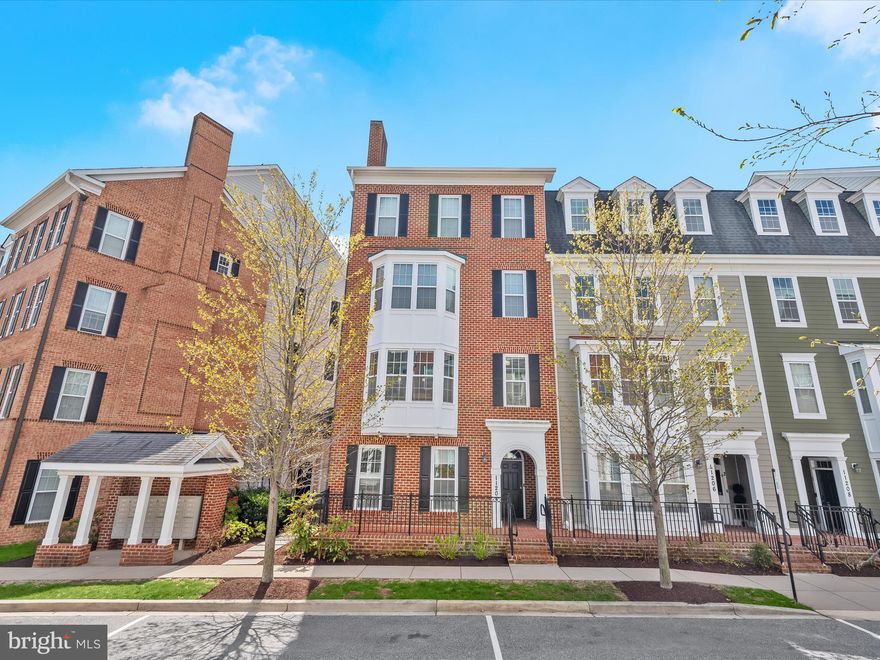 ***OFFER DEADLINE Monday April 21st***Welcome home to a beautifully designed end-of-group two-story condominium located in the desirable Midtown District of Maple Lawn! This prime location offers convenient access to the community center, pool and gym while still providing tranquil views of the pond and open space to the rear. Pristine wood flooring, bright interiors and crown moldings put the finishing touches on this modern and functional floor plan. The first level features a front bedroom, a half-bath recently refreshed with designer vanity, fixtures and new flooring, two generously sized closets, and access to the private attached garage. 

The second level offers inviting living and dining areas complete with a bay window bump-out. The kitchen features granite countertops, 42” cabinetry, stainless steel appliances, and a breakfast bar for additional seating. The primary suite is a peaceful retreat complete with a walk-in closet and luxurious bathroom with large shower and double vanity. An additional bedroom, full bath, and laundry area further enhance this exceptional home. Conveniently located close to all major Baltimore/DC commuter routes, and with enviable amenities including a resort-style community pool, tennis courts, pickleball courts, basketball courts, state-of-the-art gym and more, you’ll quickly see why Maple Lawn is one of the most sought-after communities in the region. Hurry! 11204-1 Chase Street won’t last long.