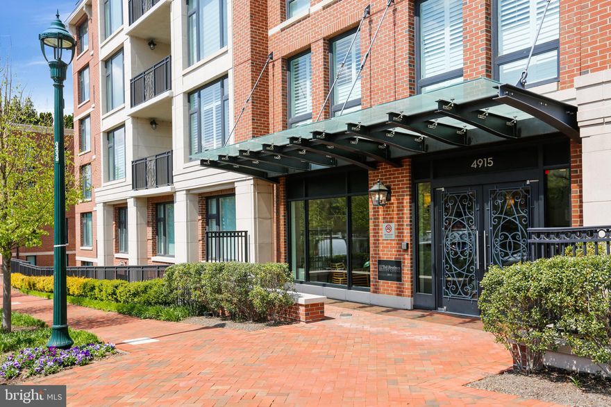 Welcome to this stylish and sophisticated one bedroom in Hampden Row, an elegantly upscale building located in the heart of Bethesda. This features of this stunning, top tier unit includes high ceilings, handsome wood flooring, large windows, overhead lighting and an open concept living area.  Gorgeous open quartz kitchen with a huge center island / breakfast bar, pendant lighting, high-end Bosch stainless steel appliances, five burner gas range, and tile backsplash. The kitchen opens to the wood-floored living room with wonderful windows and a mounted TV.  Attractive primary bedroom with an additional wall mounted TV and a sizeable walk-in closet with organizing system. Beautifully appointed bathroom with large stone double vanity, marble tile flooring, and a glass enclosed shower with a rain showerhead. Stackable washer / dryer in unit. 
 
Hampden Row offers the perfect city living lifestyle.  There is a secure lobby entry, 24 hour staffed front desk, fitness center, bike storage, and terraces offering great outdoor space and amenities including lounge seating, fire pit, and outdoor grills.  Ideally located near the Bethesda Metro, the Capital Crescent Trail, and Bethesda’s wonderful dining choices and shopping! Walk-Score of 97 out of 100!