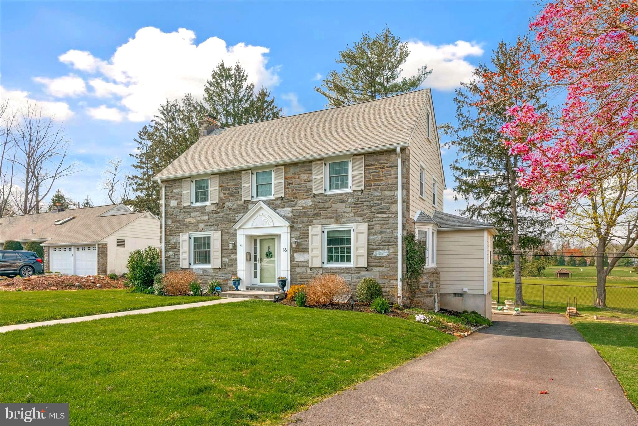 Great New Price!  Welcome to this beautiful stone center hall colonial in Merion Golf Manor!  Backing up to the World Class Merion Golf Club East Course, this home’s exclusive location offers incredible views overlooking the 7th hole fairway & beyond.  Since 2011, this home has been remodeled & upgraded.  Approaching the home you’ll notice the flagstone walkway leading to the front entrance that has been completely renovated with new door surround, crown molding, sunburst molding, & new front door with 2 elegant side lights (2018).  The curb appeal is enhanced by professionally designed perennial gardens & landscaping, newer solid wood shutters w/ black hardware, fiber cement siding & Simonton replacement windows, all accented against the classic stone facade.  Entering the home, you’ll notice the refinished hardwood floors, as the center hall runs completely through the home to the full view glass door to the back deck. The 1st floor presents a large formal living room, to the left of the center hall, with a wood burning fireplace, crown molding & recessed lighting.  2 steps at the back of the living room lead into a den or home office with built-in bookshelves & cabinetry, as well as, windows overlooking the backyard & golf course. To the right of the center hall, you’ll find a sun-filled dining room w/ bow window that opens to the beautifully renovated open kitchen.  The kitchen offers light gray Omega cabinetry, a porcelain tile floor, a built in kitchen table w/ bench (storage under seat), Bosch stainless steel appliances, custom lighting, tumbled porcelain subway backsplash, granite tops and an incredible view of the backyard & golf course out the window over sink.  Through a pocketed door off the kitchen, you’ll find conveniently located  a stylish wall papered laundry room w/ utility sink & storage, as well as, a bathroom w/ stall shower.  Heading up to the second floor you’ll find a welcoming window seat at the top of the stairs, along with an updated full hall bath w/ tub and tile surround.  The 2nd floor includes a large main bedroom w/ 2 custom organized closets and a renovated ensuite bathroom with Carrara marble top vanity, step-in shower w/ frameless glass door & storage cabinet. The second floor continues w/ 2 good sized secondary bedrooms.  Stairs off the center hall lead up to a finished third floor that includes an additional 2 bedrooms and an updated hall bath with tub.  With added insulation and 2 zone air conditioning system, a high velocity system cools the second and third floors while a traditional duct system cools the first floor. Stairs off the first floor hallway lead down to a daylight finished basement that includes 2 built-in desk areas, great living room space, large finished storage closet, and  built-in cubby/mud room area off the back exterior door.  The basement also offers a large unfinished space that houses the utilities and electric panel.  Out back you’ll find a raised deck space (over the garage) off the back den area with new retractable awning w/ wind sensor (2023), custom iron railing, and flagstone steps down to the yard.  You’ll also notice the black standing seam pent roof over the 1.5 car attached garage that includes great storage space and an electric car charger.  Additionally, there is a separate built in storage shed off the driveway, great for lawn equipment & garden supply storage.  Beyond the home & driveway, the rear yard stretches along the back fence, past the right side of the driveway, and includes mature landscaping, as well as, an incredible view of Merion Golf Club.  Located in one of the most sought after neighborhoods in Haverford Township, the location places you minutes from great local restaurants & shopping in Oakmont & Ardmore, local public & private schools, public transit along the high speed trolley or regional rail, parks, trails and all major thoroughfares.  Don’t miss this wonderful opportunity to move in the Manor!