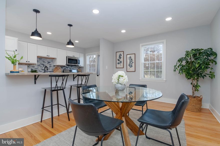 NEW PRICE***OPEN HOUSE SUNDAY***12-2PM.  Welcome home to this beautifully renovated 4BR/2BA End-of-Group Rodgers Forge townhouse!  Check out the  all-new fabulous high end kitchen, two bright new bathrooms, gorgeous wood floors, insulated replacement windows, all new lighting fixtures and recessed lighting, all new interior paneled doors and hardware, terrific lower level with nice high ceilings, all new flooring,  bonus 4th bdrm/office space and new bath, laundry center w new W/D and new exterior rear door.  Spacious level yard with flagstone patio and  parking facing open green space.  Recent updates include new water main (2025), new window well (2025), new water heater (2025), new sump pump (2025).   New HVAC and rebuilt chimney with new liner (2019). There is a  floored attic w pull down stairs for lots of accessible storage.  Don't let the steps deter you on this one! They elevate  your view and give you a window on the world away from the noise, and ,all the while  you have  your own easy rear parking access  with no steps at all! Come and see  it for yourself and check out the wonderful attention to detail  throughout.  Welcome home! (Note: front lawn was reseeded when water main was replaced)