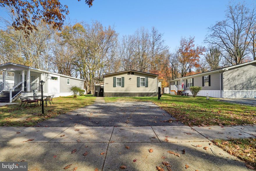Step inside this comfortable 935 sq. ft. double-wide manufactured home featuring a bright, open layout and two bedrooms — including a spacious primary suite plus a second bedroom perfect for guests, an office, or hobby space. Located in a well-kept park community with generously sized lots, this home offers extra room to relax outdoors, along with a large storage shed for tools, bikes, or seasonal items.

You’re also just minutes from the beautiful Jug Bay Wetlands Sanctuary, offering miles of peaceful walking trails, boardwalks, and scenic views of wetlands and wildlife — a wonderful nearby escape for quiet walks, bird-watching, and enjoying the natural beauty this area is known for.

Monthly lot rent is $1,078, making this an affordable and low-maintenance living option. Whether you're downsizing, purchasing your first home, or simply looking for a comfortable space with room to make it your own, this property is an inviting opportunity.

Come see the space, the setting, and the potential.  Close to Schools, Parks, Shopping and Restaurants. 20 Minutes to Andrew AFB and Chesapeake Beach. Community Perks Include Swimming Pool, Basketball, Tennis Courts & Two Tot Lots.