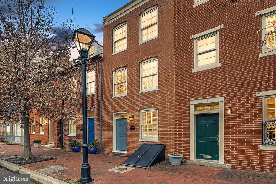 Beautifully maintained and updated Otterbein rowhome. 529 S. Sharp Street is filled with light and charm with neutral decor, exposed brick throughout, and bright living spaces. All bathrooms are newly renovated with the upper floor bathroom boasting an enviable soaking tub. The home offers two bedrooms with an additional den/home office on the entry level that could be converted into a 3rd bedroom. The main level features a large entry foyer, powder room, wood floors, and updated kitchen appliances. The master bedroom has loads of closet space and a tastefully updated en suite bathroom. Washer and dryer is conveniently located on the second floor. The large and airy second bedroom and spacious en suite bathroom are located on the third floor. The third floor opens to a two tier rooftop deck with sweeping views of the city and stadiums. This home has been meticulously maintained and thoughtfully updated with a long list of recent upgrades. The charm of historic Otterbein and proximity to the Inner Harbor, UMD, Federal Hill shops and restaurants, stadiums, and MARC train cannot be beat! One year seller paid home warranty offered!