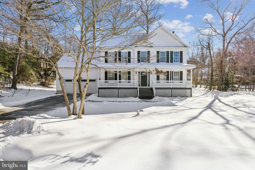 Welcome home to this lovely and spacious 4-bedroom, 2.5-bath Colonial with 2,506 square feet of beautifully designed living space, plus a partially finished basement offering expansion potential with a bathroom rough-in. Nestled on a flat .58-acre lot, this home exudes charm from the inviting front porch to the expansive brand-new back deck, which overlooks a lovely backyard with mature trees, creating a serene oasis. Inside, you'll find hardwood floors and molding that accentuate the foyer, office, and formal dining room. The spacious kitchen, complete with ample cabinetry, stainless appliances, ceramic tile flooring, and a pantry. The kitchen opens into an enormous morning room/sunroom boasting vaulted ceilings and large windows, allowing natural light to fill the space. The family room is both cozy and inviting, centered around a wood-burning fireplace. Retreat to the primary suite with its thoughtful details, including a convenient laundry chute, walk-in closet, and en-suite bathroom featuring dual sinks, a separate shower, and a corner soaking tub. The partially finished basement provides versatility, offering room to grow. The two-car garage is perfect for parking or additional storage space. The septic system was replaced in 2020. This home is being sold As Is. Located in a vibrant community near schools, shopping, and community parks, this home also offers easy access to Solomons Island’s attractions and a convenient commute to PAX River Naval Base. Hurry make your appointment today before it is gone tomorrow.