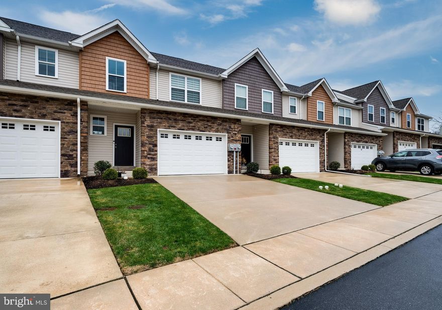 Welcome to 26 Hubbardton Ct – a beautifully maintained townhome in the desirable Glen Ridge community, located within the highly rated Wilson School District. Built in 2021, this 3-bedroom, 2.5-bath home with a first-floor office offers modern comfort, convenience, and style. As you drive into this thoughtfully designed neighborhood, you’ll appreciate the cohesive yet varied exteriors, professionally maintained grounds, and discreetly placed trash receptacles that keep the community looking clean and polished. Inside, you’re welcomed by a spacious entryway with a large coat closet and a half bath. The home opens into a bright, open-concept kitchen, dining, and living area. The kitchen features granite countertops, stainless steel appliances, an undermount sink, and a large island that’s perfect for entertaining. The living room opens directly to a maintenance-free deck with steps leading to the backyard, ideal for relaxing or outdoor gatherings. You will also find a versatile office or bonus room—perfect for working from home, a playroom, or additional living space.
Upstairs, the spacious primary suite includes a walk-in closet and a private en-suite bathroom. Two additional bedrooms and a full hall bath complete the second floor. Just off the kitchen on the main level is the laundry room and access to the oversized one-car garage, which includes extra space for storage and an outlet ready for a second refrigerator or freezer. The full, unfinished basement offers even more storage or the potential to create a custom living area, complete with an egress window for safety.
Additional features include a washer and dryer, ceiling fans with lights, keyless garage entry,  window blinds throughout, and an interior fire sprinkler system. The home is equipped with a gas furnace and hot water heater for energy efficiency.
Nestled in a quaint community 26 Hubbardton Ct is still just minutes from major shopping, restaurants, and entertainment options in Spring Township – offering the perfect balance of tranquility and convenience. Rent includes HOA fee,  Water, Sewer and Trash.