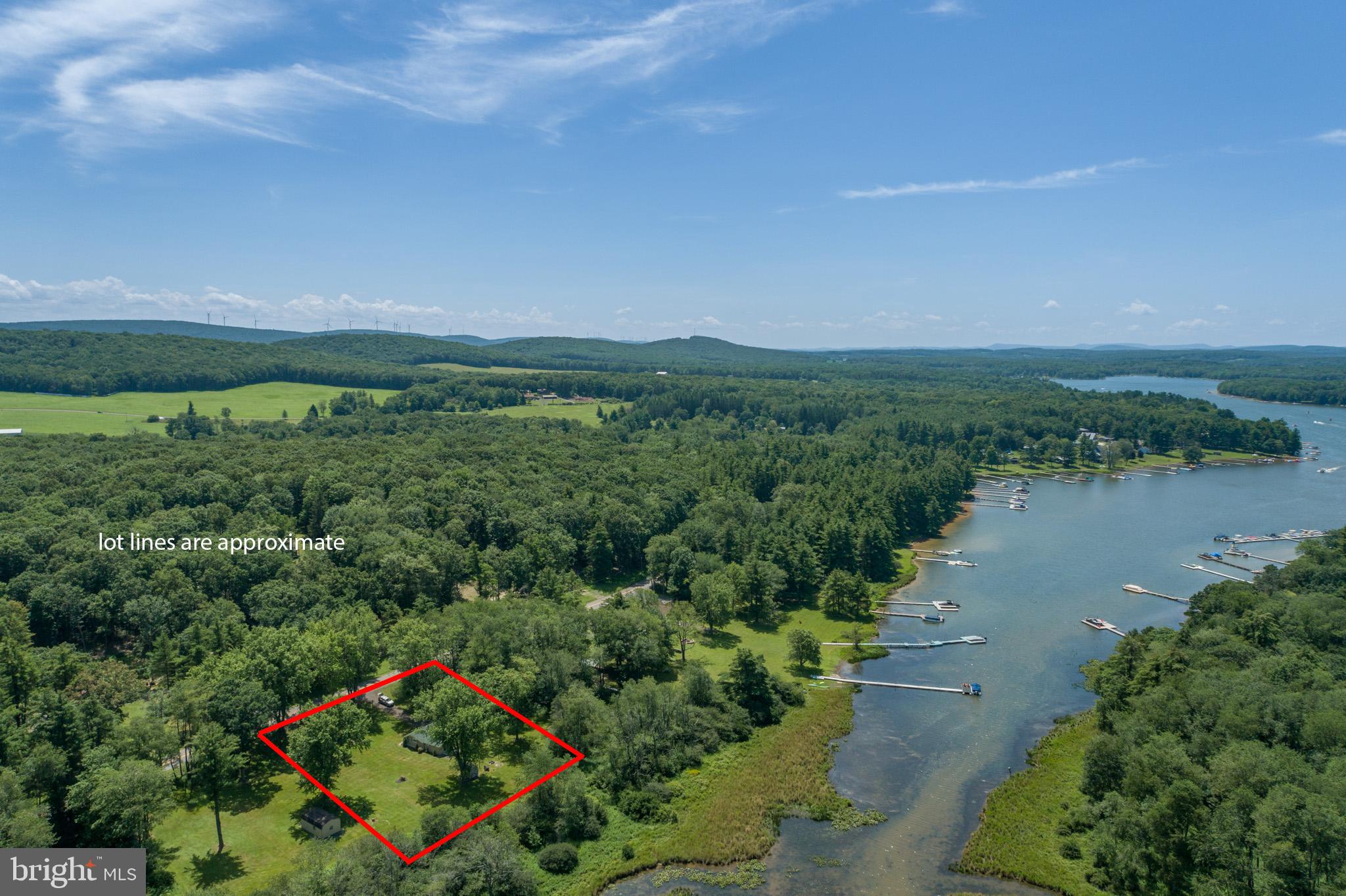 Tucked on a quiet stretch of Green Glade Road, this cozy lakefront spot keeps it simple. Covered porch for rainy-day coffee. Built-in bunks for the kids. New floors underfoot. Propane heat plus a whole-house mini split system keep you covered year-round. RV hookups on-site. Private lot with room to breathe. Clear lake views without the crowd. Classic cottage charm that does what it’s supposed to do—get you closer to the water and farther from the noise. Don't miss your chance to own your little corner of heaven... call today for details!