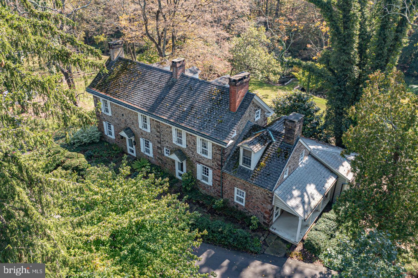 Welcome to this 30 acre hidden gem offering the authenic Bucks County experience. A classic 4 bedroom, 18th century stone manor set amongst a scenic landscape offering the utmost in privacy and beauty allowing for a magnificent family compound with separate caretaker's cottage, gorgeous barn outfitted for wonderful additional living or workspace, another barn for storage or animals, tranquil ponds and in-ground pool. Endless opportunities to own a gentleman’s farm on one of the most bucolic country lanes in Newtown. The best of both world’s allowing for a rural experience yet within commuting distance of New York City, Princeton and Philadelphia.