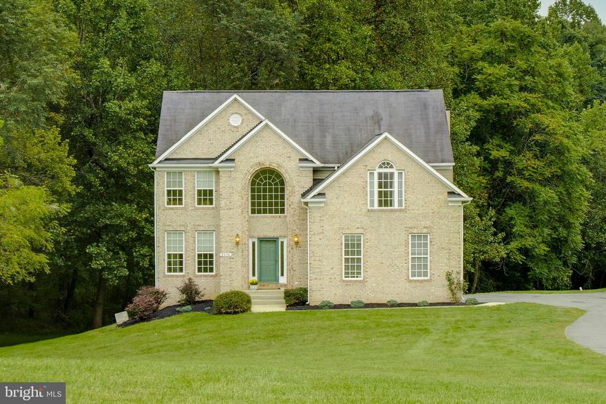 Stately Colonial home  situated on desirable 3 acre private lot in established neighborhood near Patapsco State Park. This home has been well maintained by original owner but being sold "As Is". Enjoy approx. 3,800 Sq Ft of living space over 3 levels  accented with great outdoor space - spacious rear deck, stone patio, mature trees and woods and lots open space with endless outdoor enjoyment possibilities! Generous sized rooms throughout with open concept main level with spacious kitchen and breakfast room opening to large family room. Separate living and dining rooms with main level laundry. The upper level offers a private Master Suite with sitting room, 2 WICs and nicely appointed bath. Three additional bedrooms with full bath complete the upstairs. The lower level is fully finished with an open recreation room, sliders to exterior patio, 5th bedroom and full bath with lots of storage. Reference Bright Documents for Amenities and Updates, Floor Plan and Seller Material Fact Disclosure.