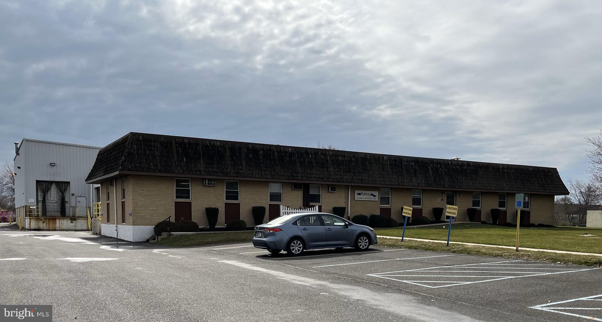 Available/vacant on 6-1-2023. Centrally located in the Northampton Industrial Park, 30 Industrial Drive is a turn key Manufacturing/Industrial Facility. The Property is approximately 25,000 square feet (public records show a different sq. ft.). The entire property is fully air conditioned. There is approximately 3,000 sq. ft. of office space (private offices, conference room as well as an open floor plan office area suitable for cubicles). There is over 22,000 sq. ft. of Industrial/Manufacturing space well suited for heavy machinery. The main manufacturing area has 1,200 amp/208 volt power, and the secondary manufacturing area has a separate 200 amp service. There are 15 cranes throughout the facility ranging from 1/2 ton to 5 ton capacity. There is a 13'x21' industrial paint booth with crane inside. The property is fully sprinklered and also has air piping throughout the main manufacturing facility. There is one loading dock serviced by two overhead doors, as well as two drive in overhead doors at the rear of the property. Parking for 50+ vehicles. The property can also be divided as it has two addresses (30 and 32 Industrial Drive). The secondary manufacturing area is approximately 6,000 sq. ft with its own private entrance, has two office spaces and has access to the loading dock and one overhead drive in door. Seller is related to Listing Agent