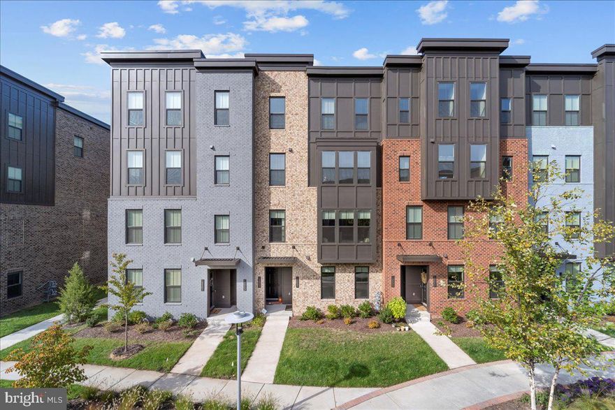 Welcome to your DREAM HOME! This gorgeous, nearly new brick-front townhouse is perfectly located just minutes from HERNDON METRO, AMAZON HQ, SHOPPING, DINING, top-rated schools, and MAJOR ROUTES - UNDER 1 MILE FROM METRO,  including the Dulles Toll Road—making your commute and errands a breeze!

Step inside to find a BRIGHT, SPACIOUS HOME filled with DESIGNER FINISHES throughout. The fully equipped GOURMET KITCHEN features CONTEMPORARY CABINETS, QUARTZ COUNTERTOPS, a FARMHOUSE SINK, PULL OUT TRAYS, USB charging ports, and STAINLESS STELL APPLIANCES—perfect for cooking and entertaining. Enjoy the convenience of a smart NEST THERMOSTAT, RECESSED LIGHTING, LUXURY VINYL PLANK FLOORS, and stunning WOODEN OAK STAIRS .

Retreat upstairs to your tranquil master suite with TWO CUSTOM WALK-IN CLOSETS and a SPA LIKE bathroom boasting a dual vanity and frameless shower. Two ADDITIONAL bedrooms with CUSTOM CLOSETS, a FULL DESIGNER BATH, a PRIVATE BALCONY, and a large LAUNDRY ROOM WITH SINK complete the upper level.

Additional highlights include a fully FINISHED GARAGE WITH EPOXY FLOORING and smart app-controlled opener, a spacious storage room. 

Step outside to enjoy the woods/park or relax on a comfortable patio overlooking serene woods with tot lot!  Come and fall in love with this home that offers a harmonious blend of community, convenience & natural beauty—your own peaceful oasis nestled in nature. SCHEDULE YOUR TOUR NOW & START LIVING YOUR BEST LUXE LIFE!