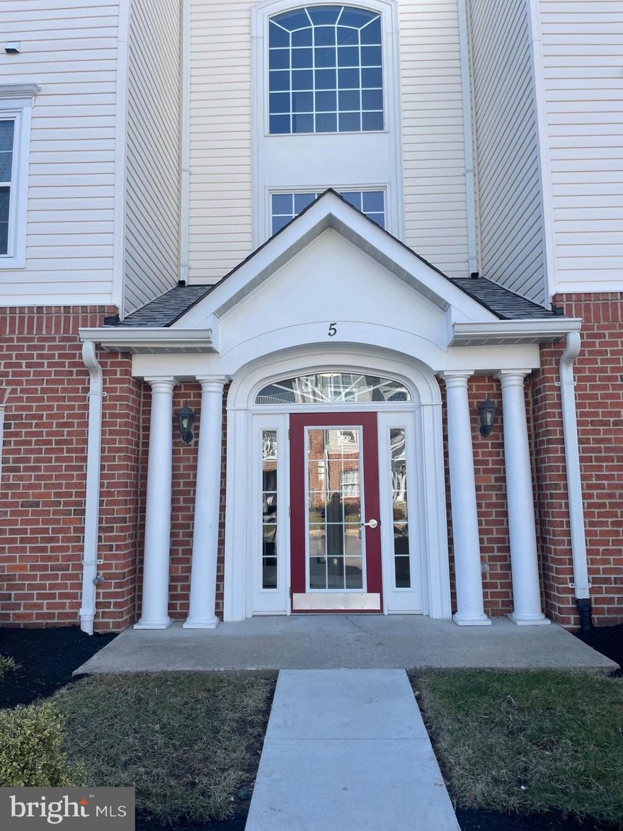 Welcome to this wonderful  2 bedroom, 2 bathroom first floor condo in  Perry Hall Farms.  This is a great opportunity to own one of the large end units in the subdivision. The foyer opens into a large living room/dining room combo. The bonus sunroom gives you that needed additional space and opens to a private garden terrace. The kitchen has a convenient pass through. The primary bedroom suite includes a large walk-in closet and bathroom with shower. It also has an extra window on the side because it is an end unit. The home has been  well maintained. Bathrooms and kitchen are clean and in great shape.  Newer stainless dishwasher.  Newer gas hot and gas heat.  Nine foot ceilings. Lots of windows. Dual access from either the secure lobby with elevator or from the patio. Second bathroom can be accessed from the living room or the second bedroom. This is a nice house waiting for your personal touch.