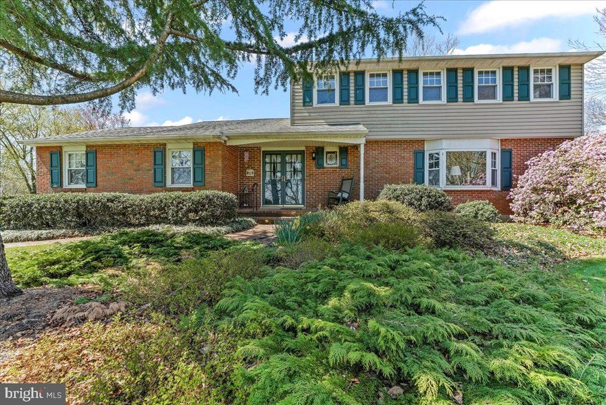 Set on beautiful White Horse Road and overlooking miles of farmland, that embraces the beauty that Chester County is known for, is a custom colonial home on a 2.9-acre lot! Foyer, with a dramatic curved stairway, greets all who enter. Large living room, with an elegant bay window, provides a quiet sitting area to reflect after a long day and enjoy the views. Dining room opens to the country kitchen for ease of entertaining. Quartz counters with a deep farm sink and ceramic tile backsplash, are accented by numerous cabinets, a ceiling fan and a pantry closet. Opening off the kitchen is the family room—the perfect gathering area on a cool evening. Skylights and vaulted ceiling are the perfect setting for the beautiful brick fireplace with a raised hearth and propane logs. Opening off the family room is a 3- season sunroom, with its own propane stove and ceiling fan. Amazing views of the back yard and gardens will make this room perfect for evening meals or that morning cup of coffee. The first-floor laundry, with its own outside entrance, is perfect as a mudroom for trips in from the yard. Climbing the dramatic curved stairway will lead you to the 4 bedrooms and the hall bath. Primary bedroom features its own bath with a stall shower and gleaming porcelain floor.  Walk in closet and ceiling fan add to the bedroom highlights. Additional 3 bedrooms have generous closets and are easily served by the hall bath with its tub/shower combination. Additional features are an attached 2 car garage, deck that was updated in 2022, whole house generator and a large shed for all your yard equipment. This one-of-a-kind property was loved by the current owner and is ready for its new chapter.