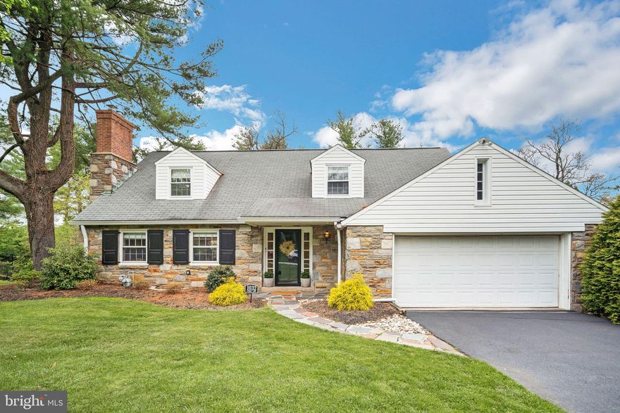 **Back on the market!  Showings start at the Open House on SATURDAY, 4/26.**  Experience the charm of this meticulously updated 5-bedroom, 4-bathroom cape nestled on a scenic half-acre lot. Revel in picturesque views from both the front and rear of the property. As you step inside, be greeted by oak random width pegged hardwood flooring in the living room, complemented by a chevron marble fireplace surround, recessed lighting, and custom millwork. The dining room boasts beautiful inset cabinets and caged chandelier lighting, leading to a kitchen perfect for entertaining guests. Admire the Calacatta Noble quartz countertop, Shaker cabinets, stainless steel appliances, and ceramic subway tile wall finish. A den with a vintage Malm fireplace and Pella sliders opens to an elevated rear porch with Trex decking. The first floor also features a spacious bedroom with built-in bookcases and a Pottery Barn vanity in the bathroom. Upstairs, find four bedrooms with ample closets and two full bathrooms, including a master bath with a vaulted ceiling and stunning tile finishes. The lower level offers a finished laundry room with vinyl plank flooring, new cabinets, and a bonus/work-out room with its own full bath. Additional upgrades include 200 amp service, new HVAC, plumbing, windows, doors, and landscaping. Located near Abington Friends School, Abington Arts Center, Avelthorpe Park, and local dining and shopping.