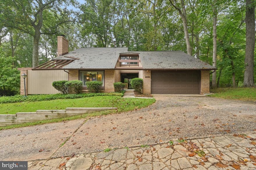 This contemporary style detached home offers four bedrooms, two full bathrooms, and one-half bathroom. Showcasing original 1970s character the home features a working elevator, exposed beams, and a breezeway patio. Interior details include both carpet and hardwood flooring. A unique opportunity to own a property with timeless design elements, plenty of space and opportunity to make it your own.