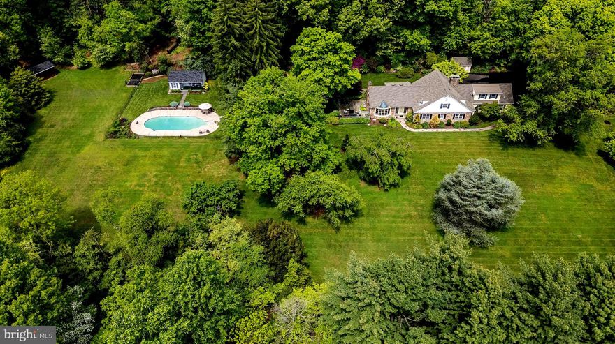A tree lined driveway welcomes you to this estate property at  550 Swamp Road, Doylestown Township, a Luther Nash built home lovingly maintained inside and out. This magnificent property features 5.55 acres of expertly planted gardens. Multiple outdoor entertaining spaces including a covered patio and sitting area, a terrace with beautiful fountain overlooking the in-ground salt water pool. The property features a cabana with a bathroom for guests to use by the pool, beyond the pool is a barn for equipment storage. This stately home has an expanded two car garage with space for a workshop, bike and other storage. Four bedrooms, three full baths and a half bath in the finished basement. The current home office could be easily converted into a first floor master bedroom if required for a potential buyer. The home provides the ideal sanctuary for rest and relaxation in the multiple living spaces and gardens. Build in 1956 this home has been owned by just two families, come and see for yourself what makes this home so special.
