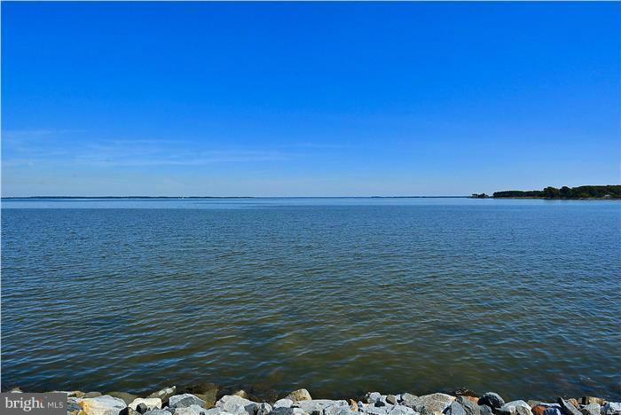 Incredible water views, gentle breezes & water lapping on shoreline. Launch your kayak, enjoy coffee on your veranda, step out on your upper decks off of each bedroom. Vacation where you live! Remodeled w/ Granite counters, SS Appliances, open floor plan, heated HW flooring, plenty of light, 2BRs & a loft, new heat pump, water heater, etc. Comm CH, pool, tennis, racketball & more.