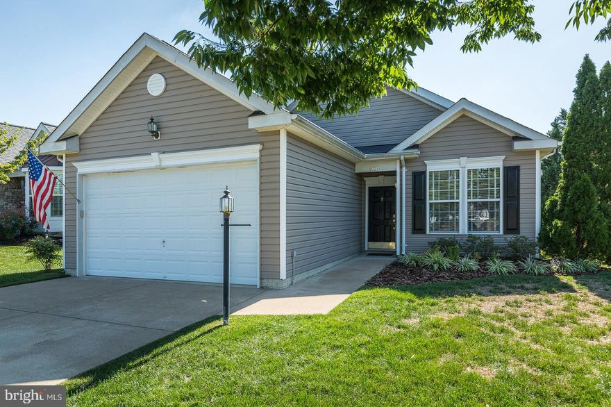 Welcome home to this light filled home located in the 55+ active adult community of Four Seasons. This one level home has 3 bedrooms and 2 full baths; approximately 1,850 square feet. Through the front door you enter into the living room with crown molding; the formal dining room features crown molding, chair railing and a bump out.  You'll enjoy the kitchen with lots of counter space, upgraded cabinets, tile backsplash, tile floor plus a sunny breakfast nook.  Off the kitchen is a cozy family room with gas fireplace.  Both the kitchen and family room feature crown molding.  From the family room you step outside into the large screened in porch with Trek flooring perfect for an afternoon or evening get together with family and friends.  The master bedroom features a tray ceiling, large bump out, walk in closet and an updated bathroom with beautiful tile in the walk in shower, dual sinks and a jetted tub.  The living room, dining room, family room and office have been freshly painted.  Awesome club house with indoor and outdoor pools, tennis courts, exercise classes, work out room, library, nature trails and more.  Close to I-95, shopping, restaurants and Potomac Mills.  This home is waiting for you.